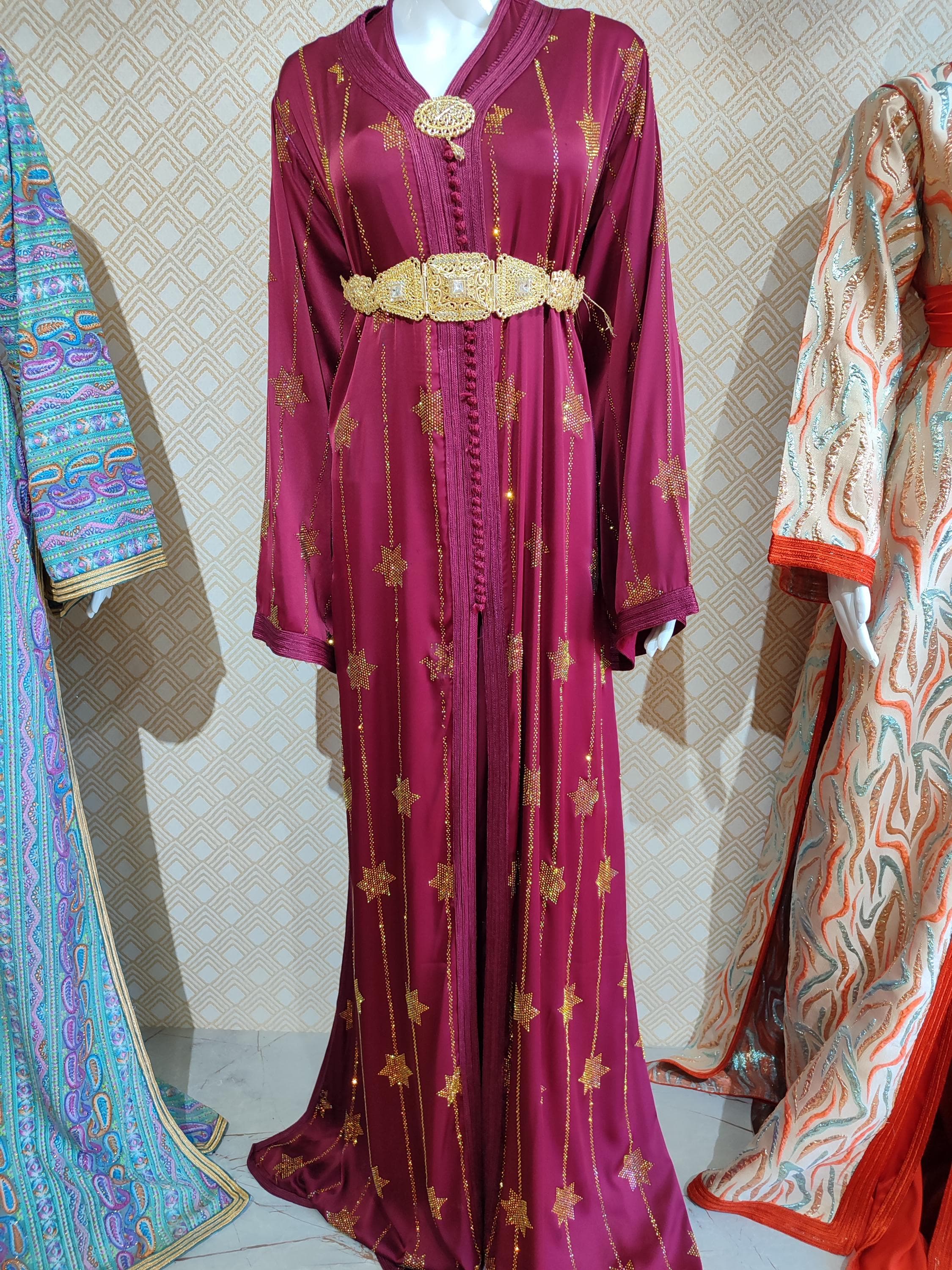 Embrace timeless tradition with this stunning Moroccan takchita. This exquisite Arabic Islamic dress is a masterpiece of craftsmanship, designed for the modern bride celebrating her nikah. Worn as a complete ensemble, the detailed embroidery and luxurious fabrics create a majestic look suitable for a royal wedding dress event. This elegant kaftan is also a perfect choice for a henna dress, making it a versatile and cherished piece for multiple wedding events.