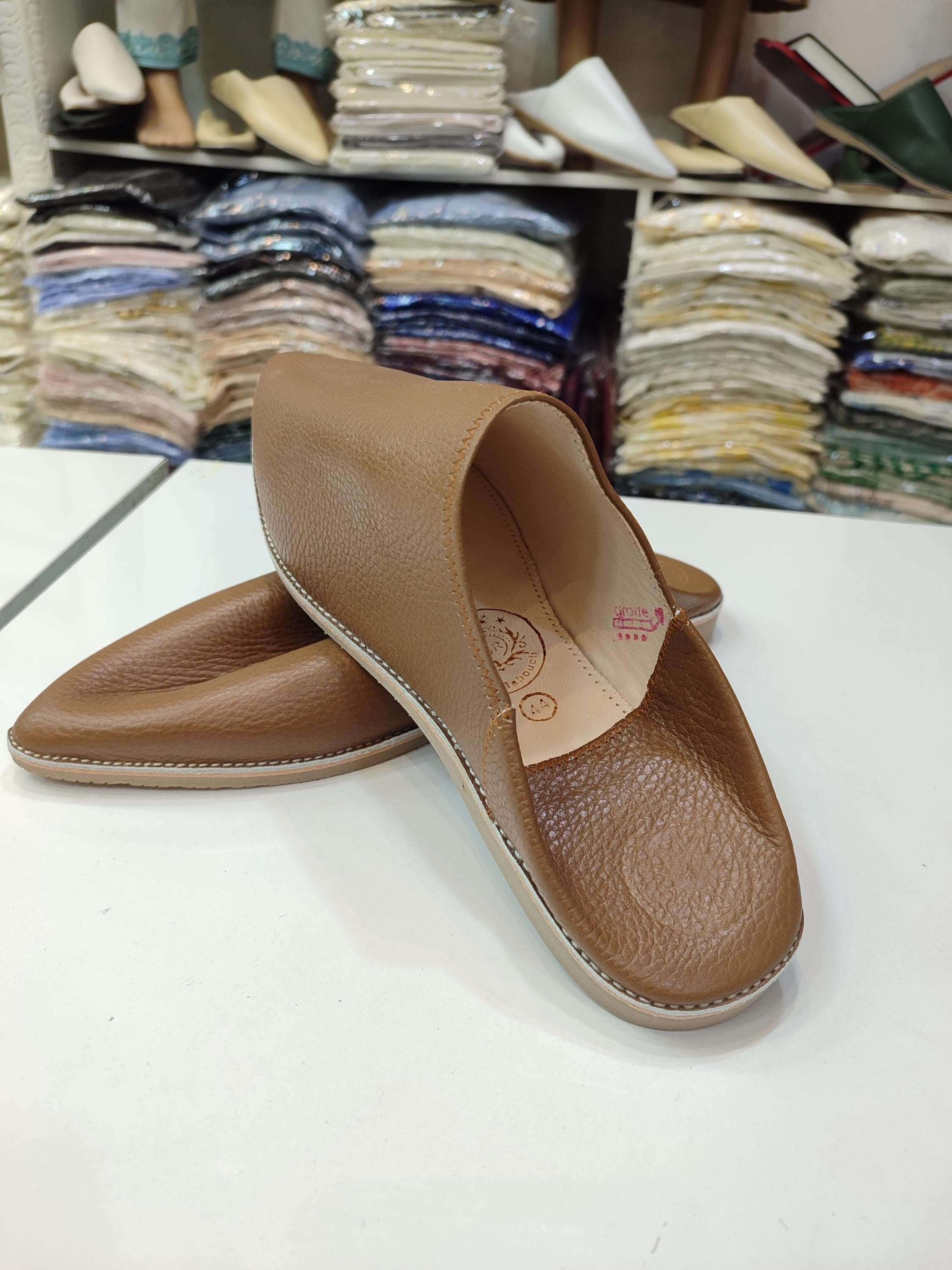 These handcrafted leather mules showcase the exceptional skill of moroccan leather craft at its finest. Made from premium goatskin and cowhide, these mens moroccan babouche slippers offer a perfect balance of durability and softness . The pointed toe leather mules feature a reinforced sole suitable for both indoor and outdoor wear, making them versatile traditional moroccan slippers for daily use .