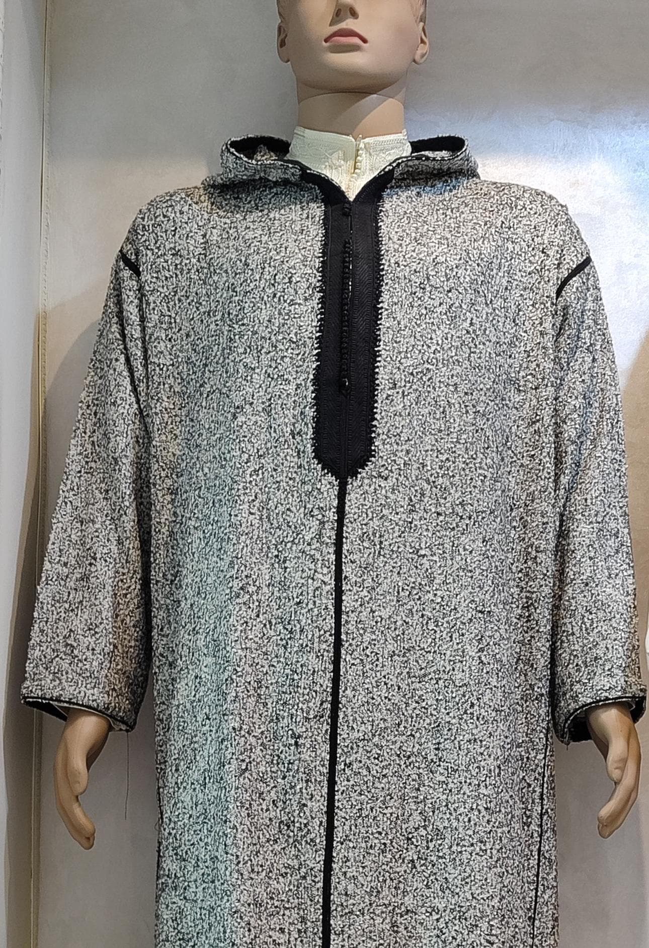 This authentic Moroccan wool djellaba is handcrafted by skilled Moroccan artisans using premium wool for ultimate warmth. Perfect as a winter djellaba, this Berber djellaba features traditional embroidery and a bohemian style hood. The oversized jellaba design offers comfort for Ramadan outfits or daily wear. A perfect Eid gift for women who appreciate Moroccan fashion and quality handcrafted djellaba pieces.