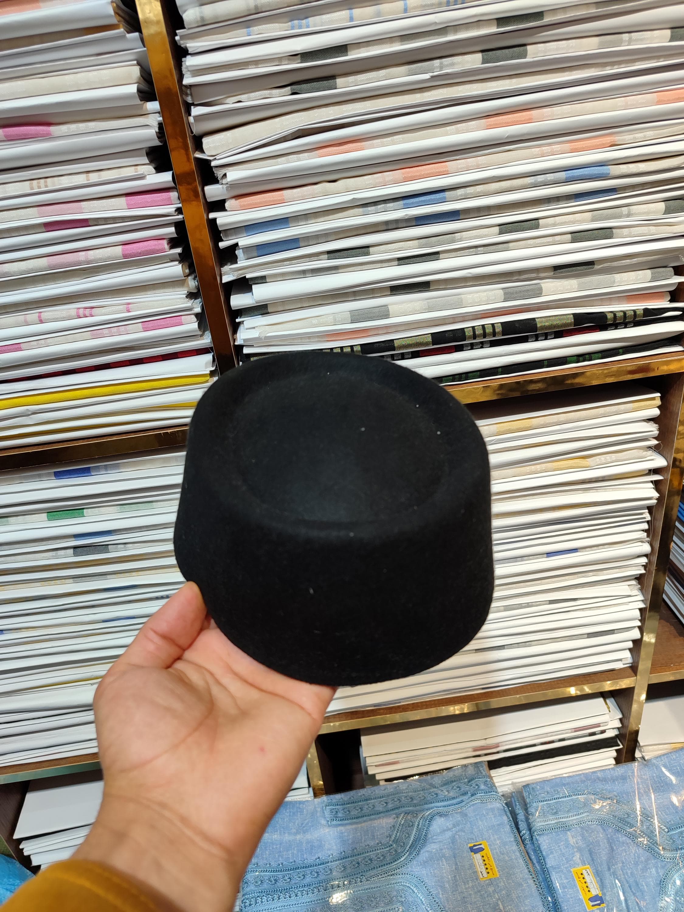 Step into tradition with this Handmade Fez Hat a black velvet masterpiece inspired by Moroccan tarboosh and Ottoman heritage. Ideal for cultural events, religious gatherings, or as a unique mens felt hat, this premium-quality fez adds a touch of elegance to any look. Whether worn with a djellaba marocaine or as part of Igbo or Hausa cultural attire, this wool felt hat represents refined, traditional men’s headwear at its finest.