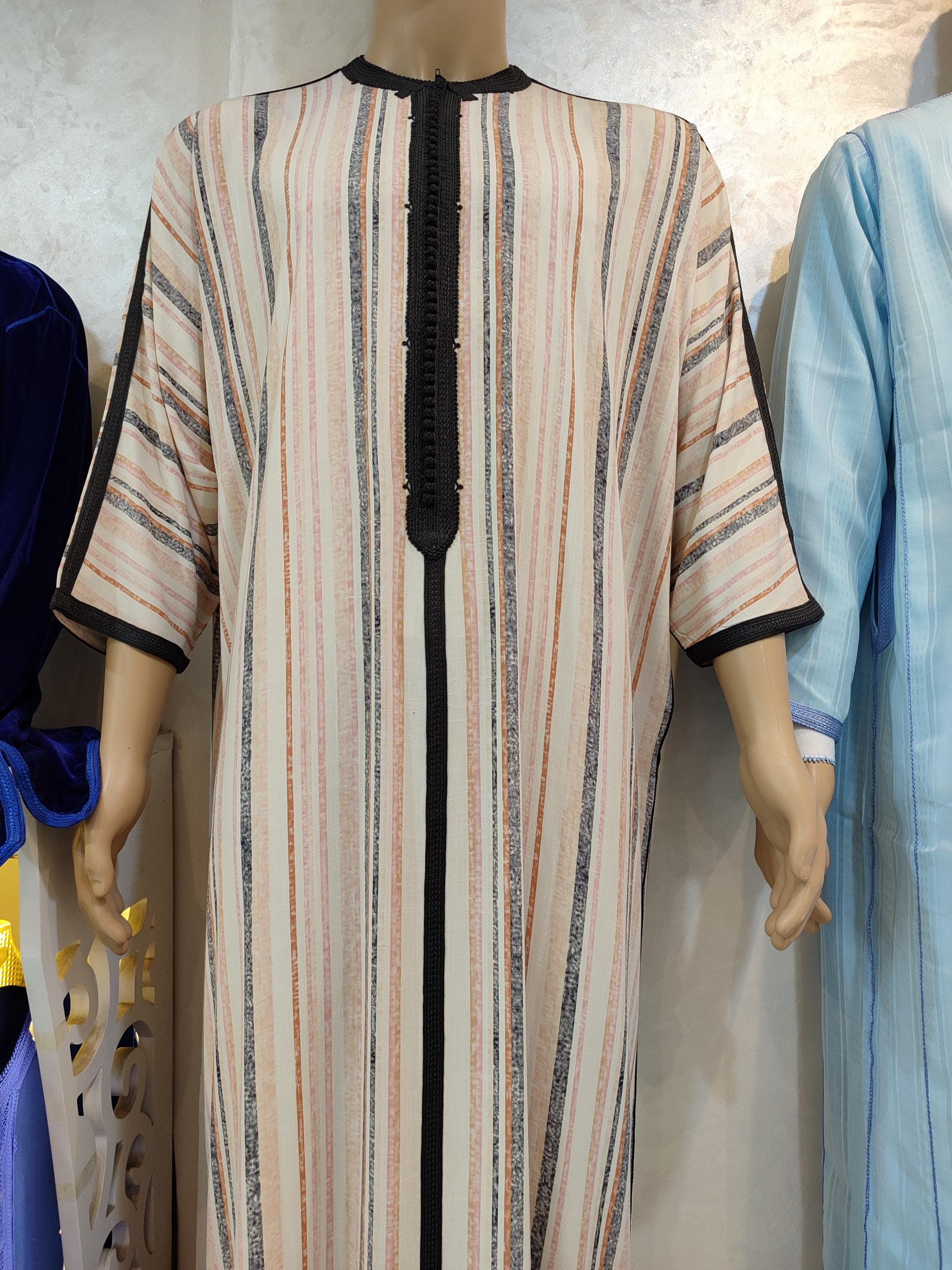 Elegance meets spirituality in this linen kaftan for man  a lightweight and breathable version of the classic djellaba man. Its minimalist design takes cues from both the qamis and maxi kaftan for man, offering a perfect balance of modesty and style. Ideal for summer prayers, Friday mosque, or simply relaxing at home, it’s a must-have for men who appreciate traditional garments with modern comfort.