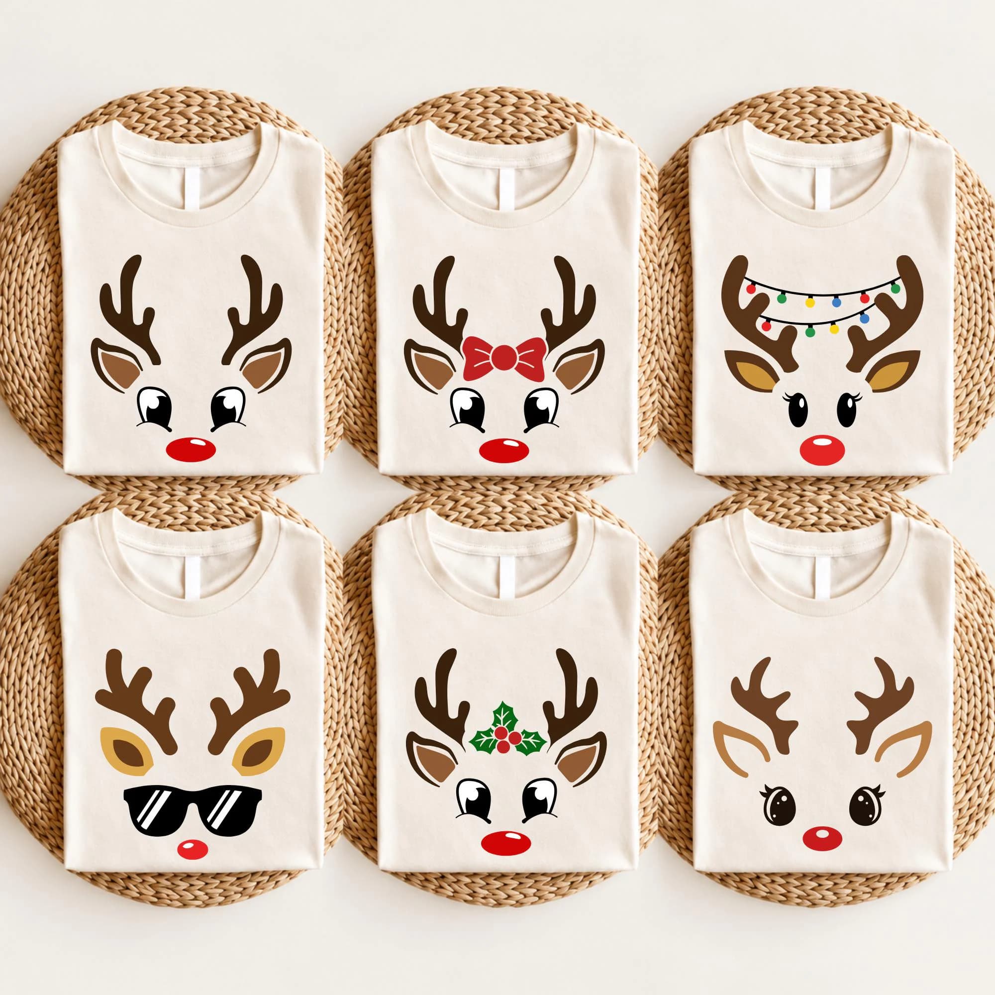 six white t-shirts with unique designs of reindeer faces, each with different expressions and accessories.