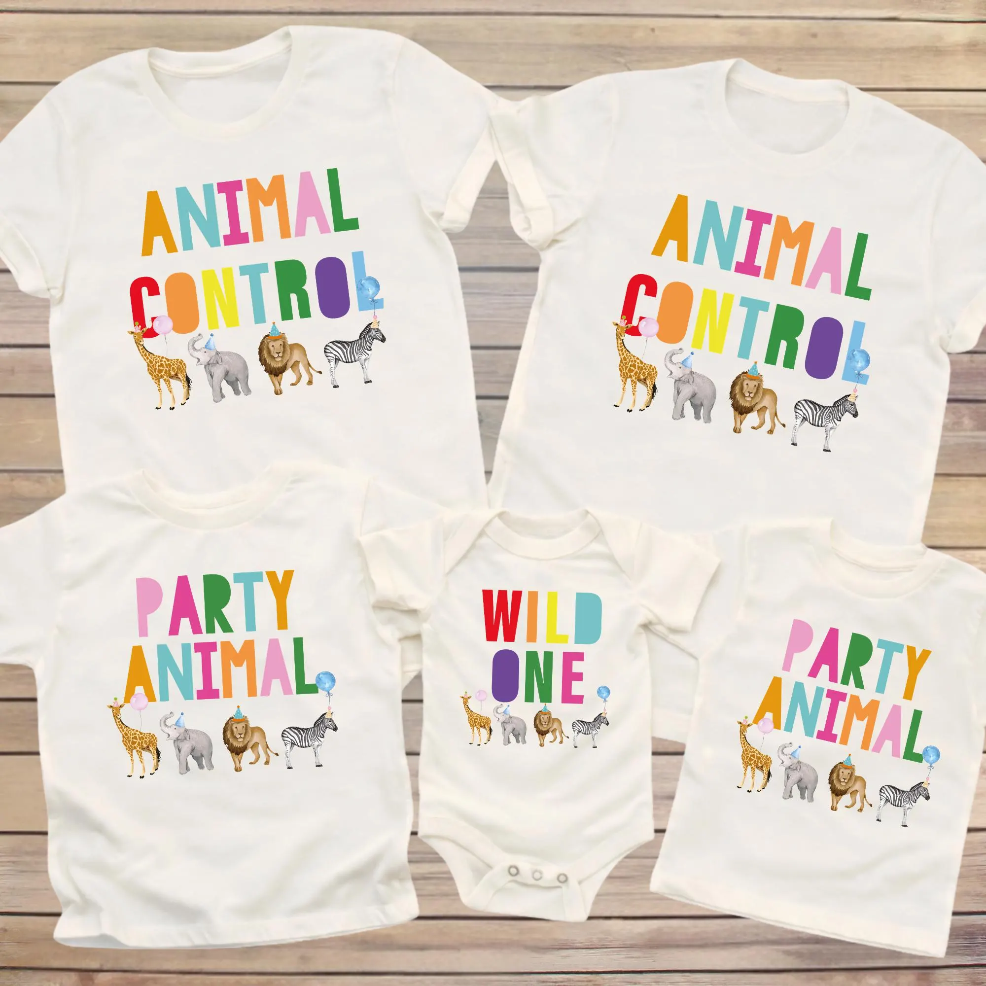 a collection of white t-shirts with colorful animal illustrations and text, including the words "Animal Control" and "Wild One".