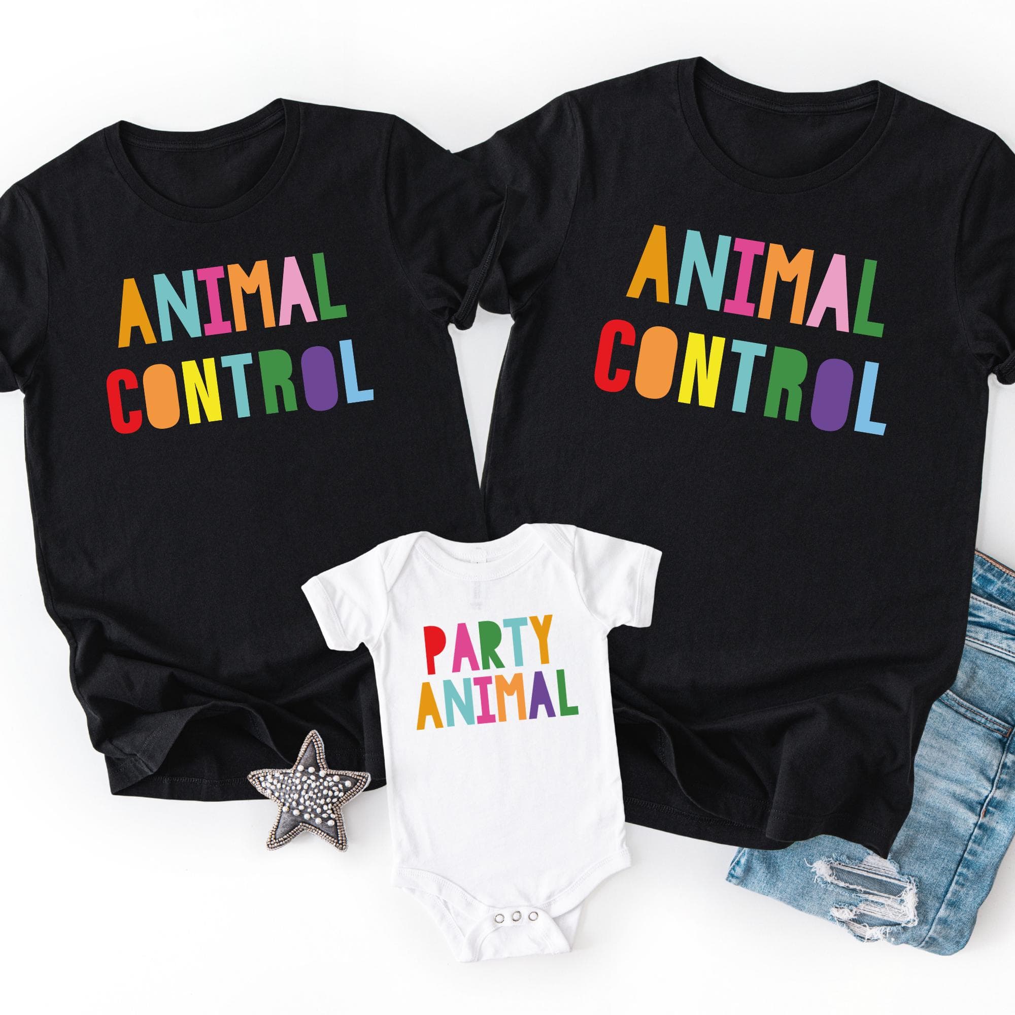a collection of three black t-shirts with the phrase "ANIMAL CONTROL" printed on them, along with a small white onesie that reads "PARTY ANIMAL". The t-shirts and the onesie are placed on a white background, and there is a small star decoration in the bottom left corner.