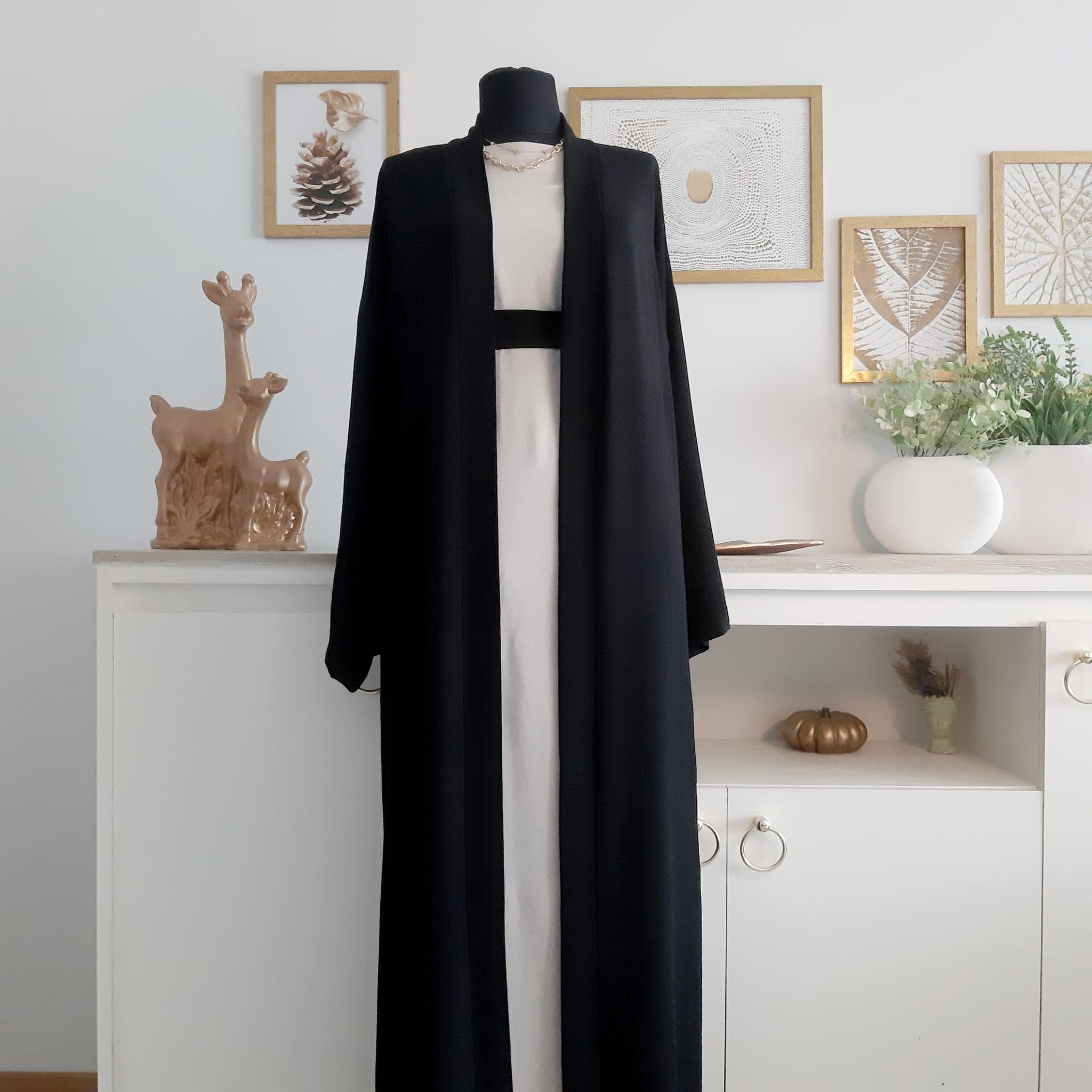 Close-up of crepe fabric texture and sleeve cuff detail – optional elastic or plain finish