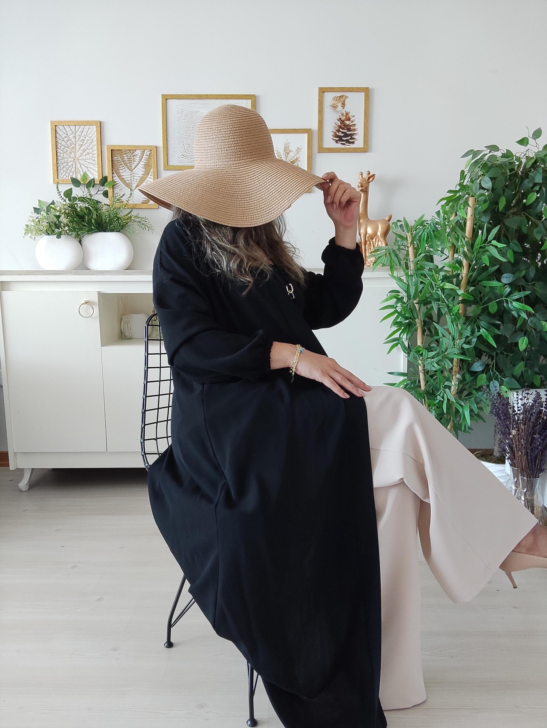 Side profile of flowing black abaya maxi dress with breathable fabric and relaxed fit