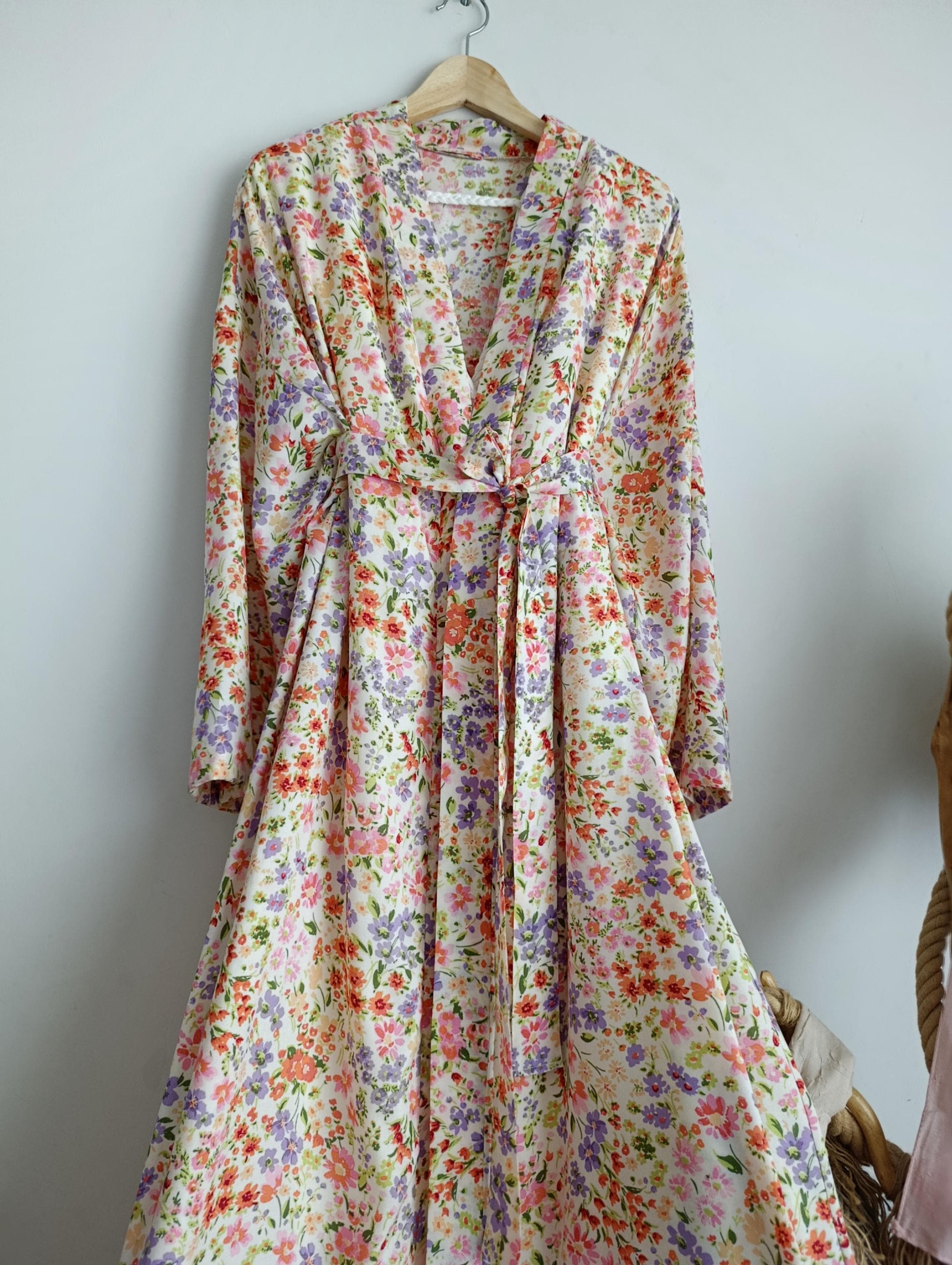 Kaftan luxury modest dress with soft fabric and detailed floral trim, part of a modern abaya set