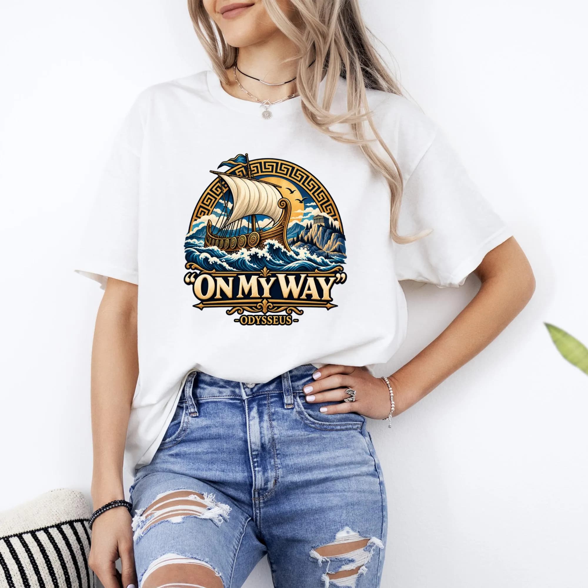 White t-shirt featuring a graphic of a Viking ship sailing on waves with the text "ON MY WAY ODYSSEUS".