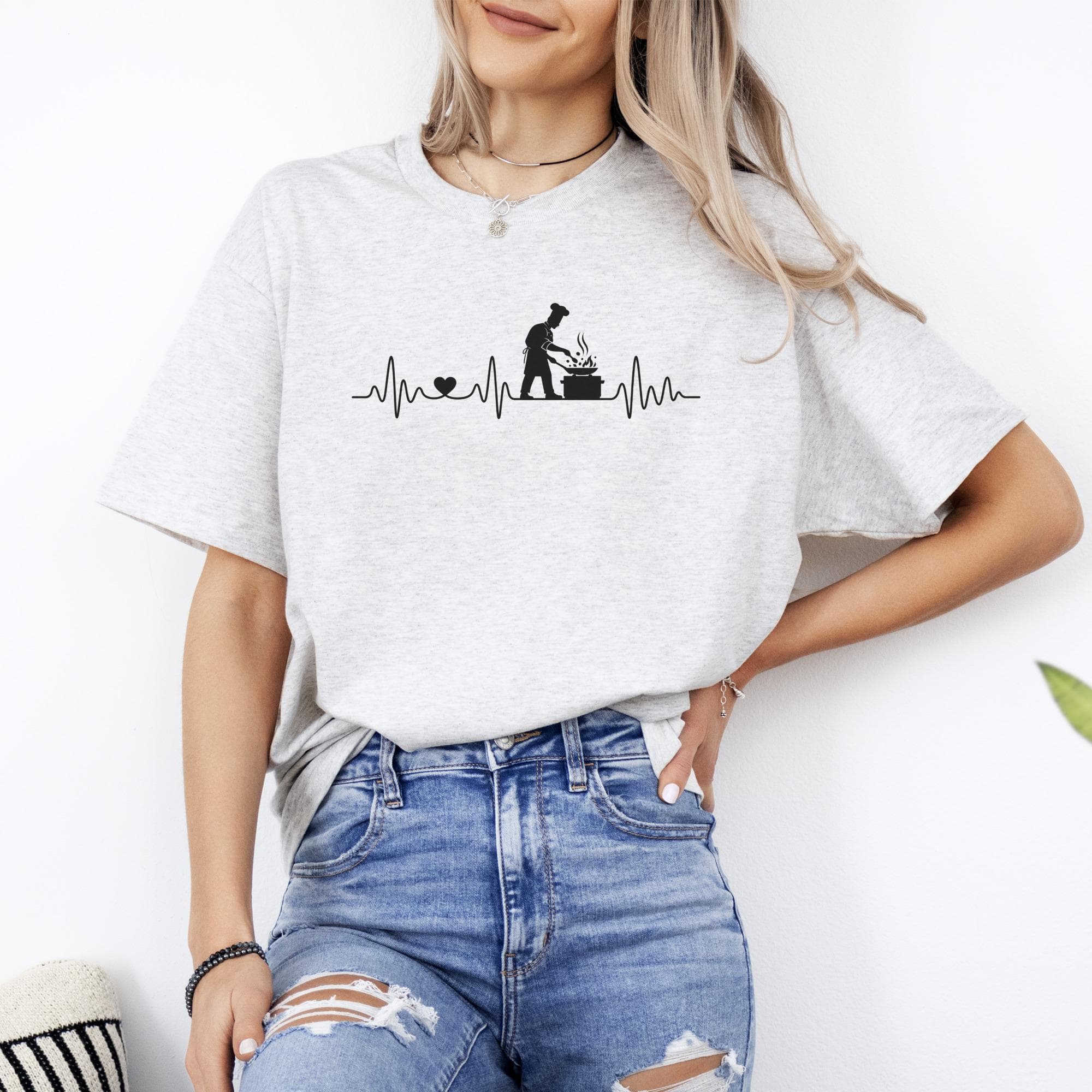 Chef heartbeat graphic on a light gray t-shirt with a blue distressed denim background.