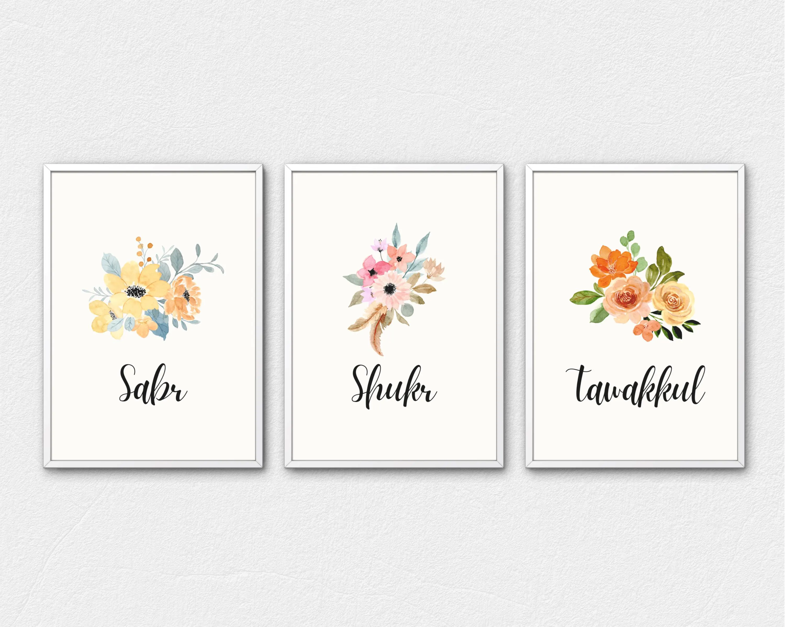 Set of three minimalist Islamic wall art prints displayed in white frames on a neutral wall, each featuring soft watercolor floral illustrations with the words “Sabr,” “Shukr,” and “Tawakkul” in elegant script. The image shows coordinated pastel tones, clean typography, and framed scale suitable for calm, faith-inspired home décor.