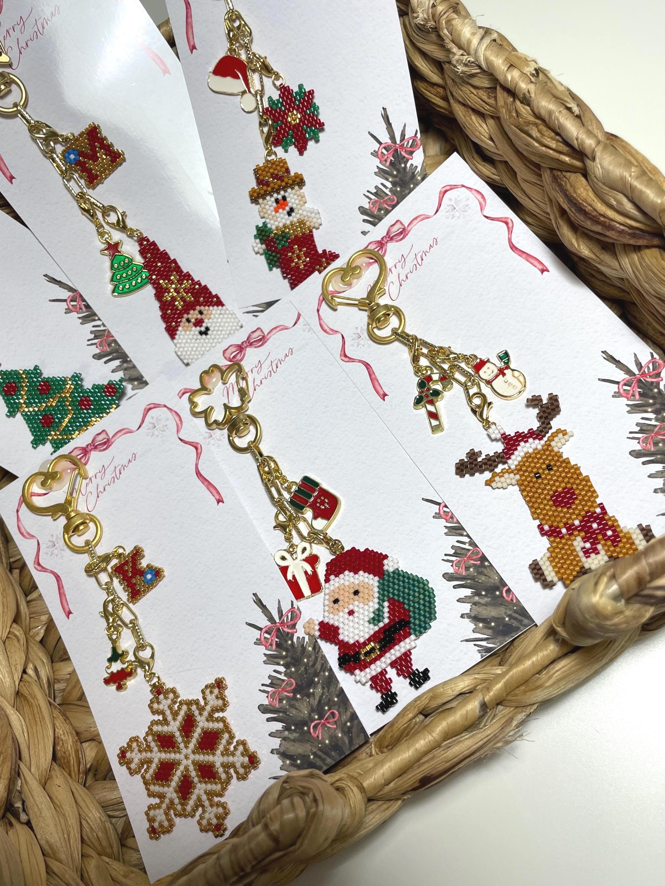 Bring holiday cheer wherever you go with this handmade beaded Christmas Santa & pine tree ornament! Perfect as a keychain, bag accessory, or meaningful gift for loved ones. The design features a Santa Claus, pine tree, and a matching mini gift ornament, all with festive red, green, gold, and white details.