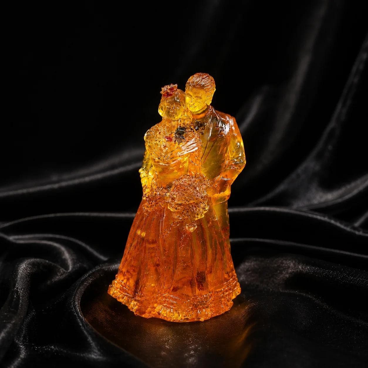 KIZIMA amber wedding sculpture, close-up of translucent honey amber craftsmanship