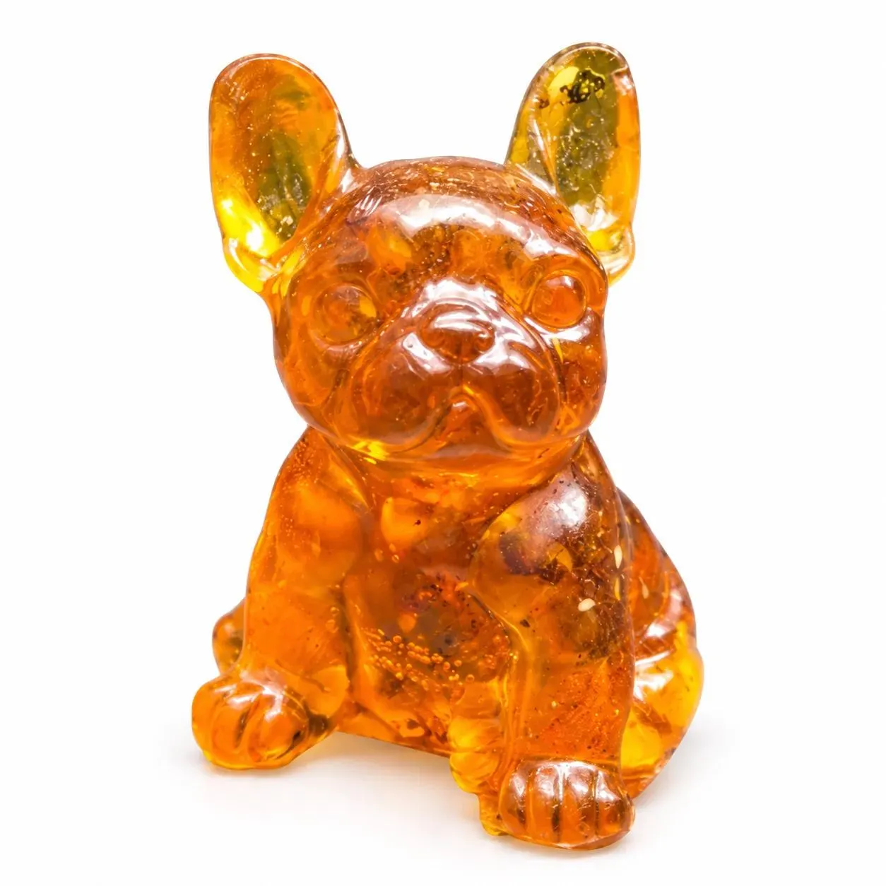 Natural honey amber French Bulldog figurine with bat ears and a flat muzzle on a clean white background.