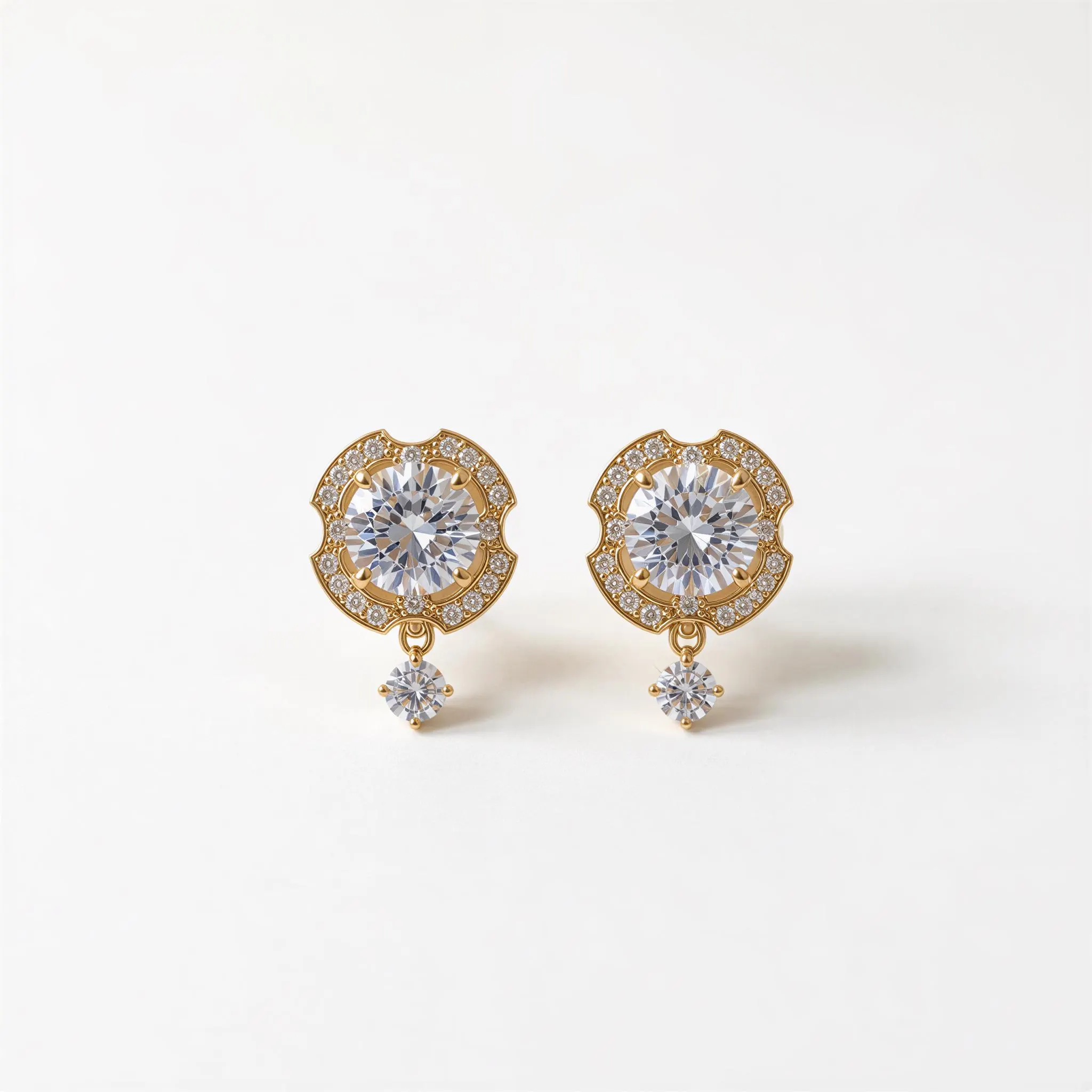 A pair of elegant gold earrings with large, clear gemstones set in a scalloped design, with dangling charms.