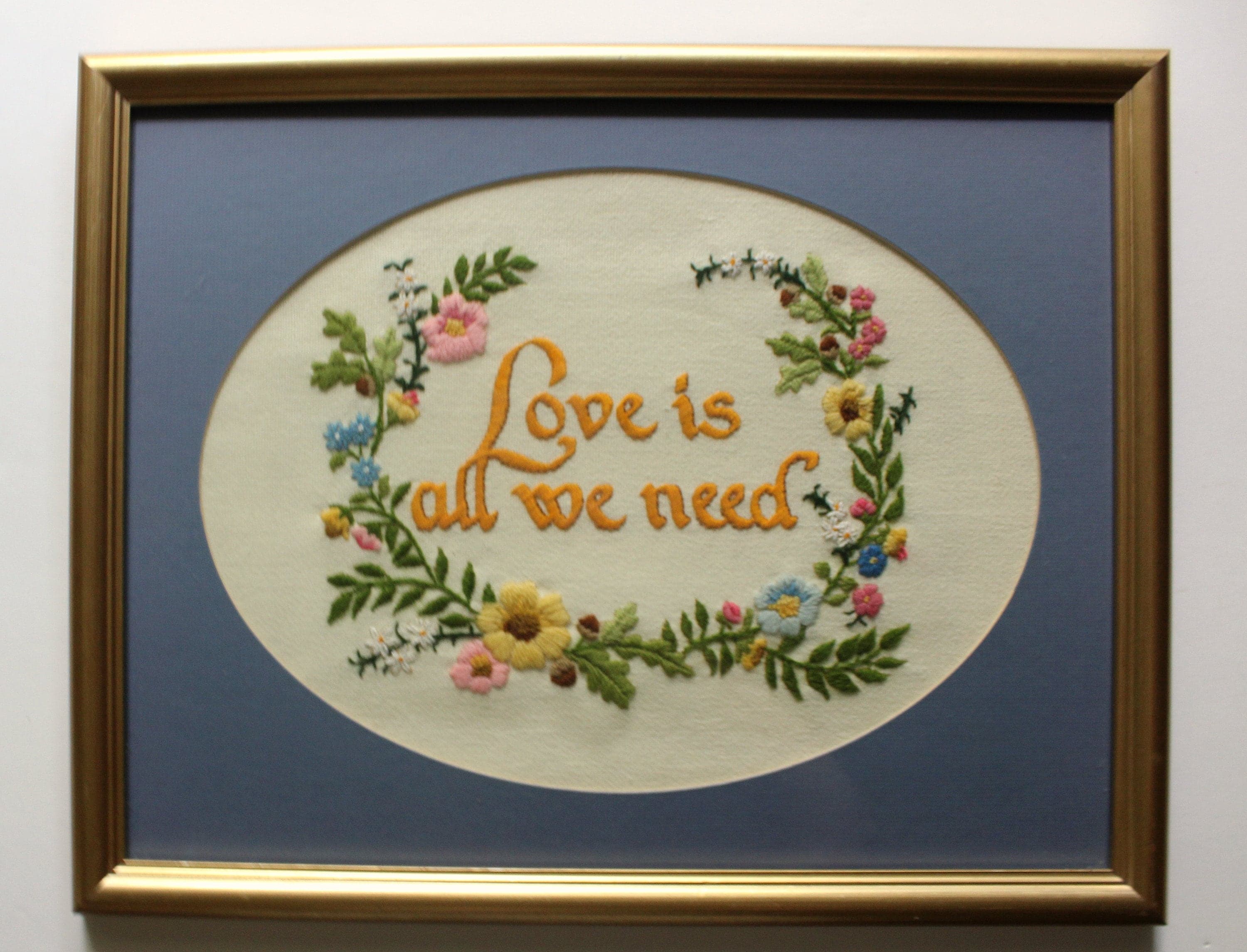 Vintage Floral Bordered Love Is All We Need Crewel Wooden Framed Art 1970s
