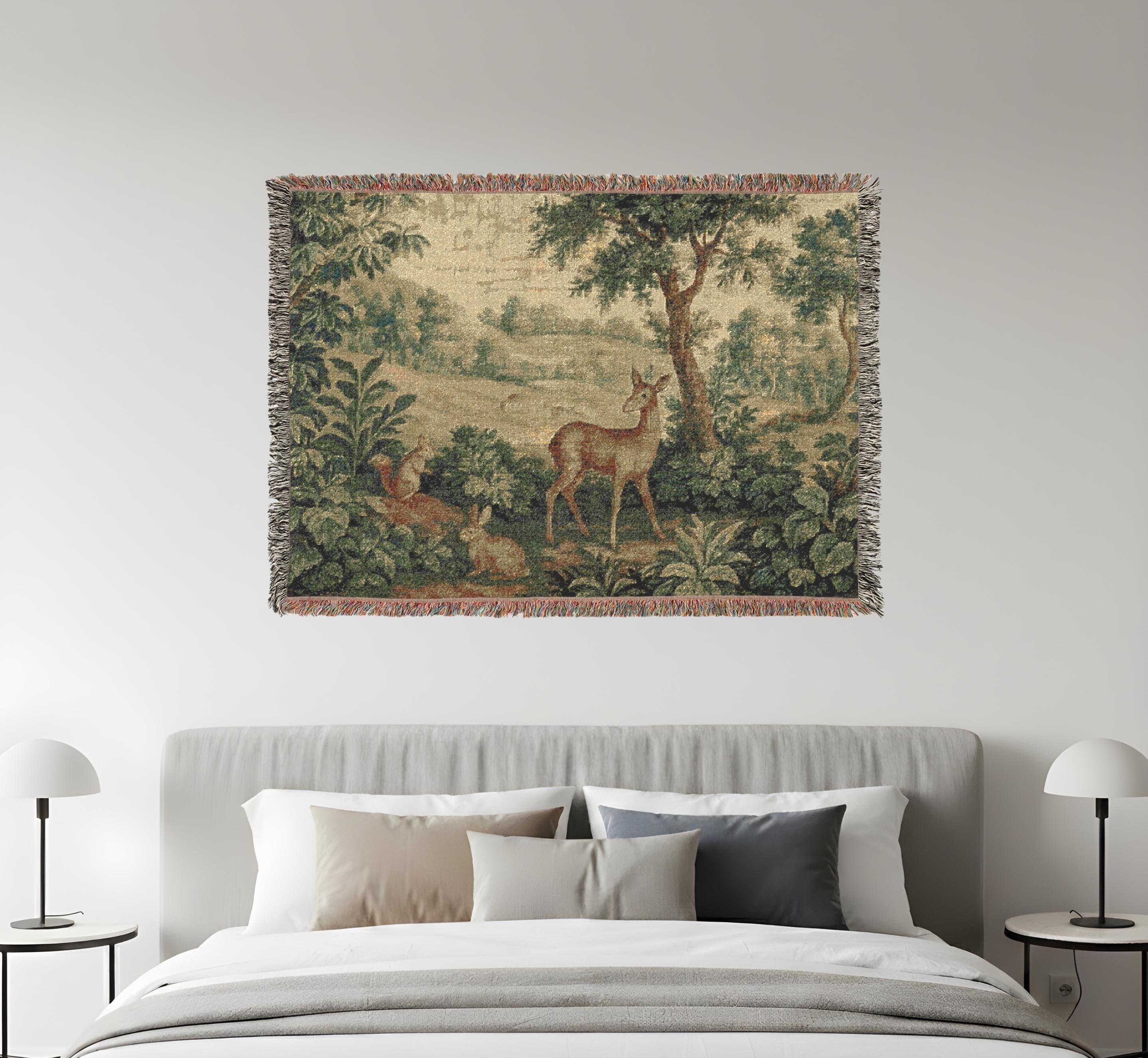 Vintage woven tapestry blanket featuring a serene forest landscape with deer and rabbits, inspired by classic French verdure wall art. This large wall tapestry doubles as a woven blanket throw or elegant wall hanging, perfect for rustic, cottagecore, or antique-inspired interiors. Adds timeless charm and natural beauty to bedrooms, living rooms, or gallery-style decor settings.