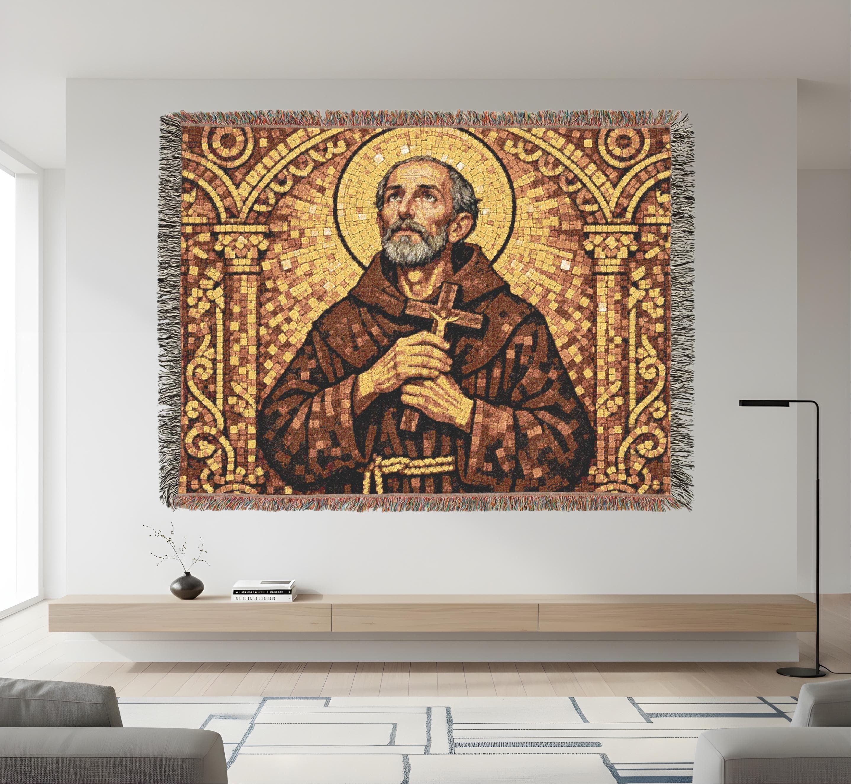 Religious woven tapestry blanket featuring a vintage mosaic-style saint with a golden halo, holding a wooden cross, framed by ornate arches in warm gold and brown tones. Fringed woven throw that works as tapestry wall art, Catholic wall decor, Christian wall hanging, prayer room or church decor. Medieval inspired textile, classic wall tapestry, sacred art blanket, cozy statement decor for bedroom or living room. Meaningful gift for Catholic friends, confirmation, baptism, or house blessing.