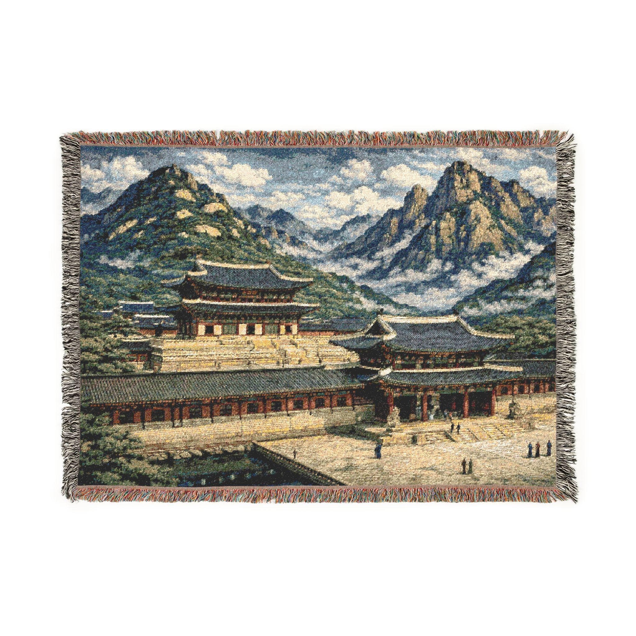 Woven tapestry wall hanging and cozy woven throw blanket featuring a Korean palace scene with traditional hanok roofs, stone courtyard, misty mountains, and blue sky. Vintage inspired Asian landscape wall decor with fringe edges, perfect for Kdrama fans, Korea travel lovers, and zen home styling. Use as large wall tapestry, classic wall tapestry art, or blanket throw for living room, bedroom, dorm, meditation space, and studio. Thoughtful gift for history lovers and East Asian decor collectors.