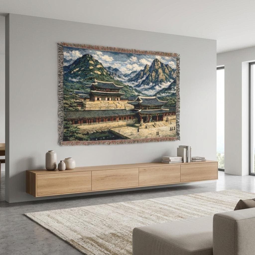 Woven tapestry wall hanging and cozy woven throw blanket featuring a Korean palace scene with traditional hanok roofs, stone courtyard, misty mountains, and blue sky. Vintage inspired Asian landscape wall decor with fringe edges, perfect for Kdrama fans, Korea travel lovers, and zen home styling. Use as large wall tapestry, classic wall tapestry art, or blanket throw for living room, bedroom, dorm, meditation space, and studio. Thoughtful gift for history lovers and East Asian decor collectors.