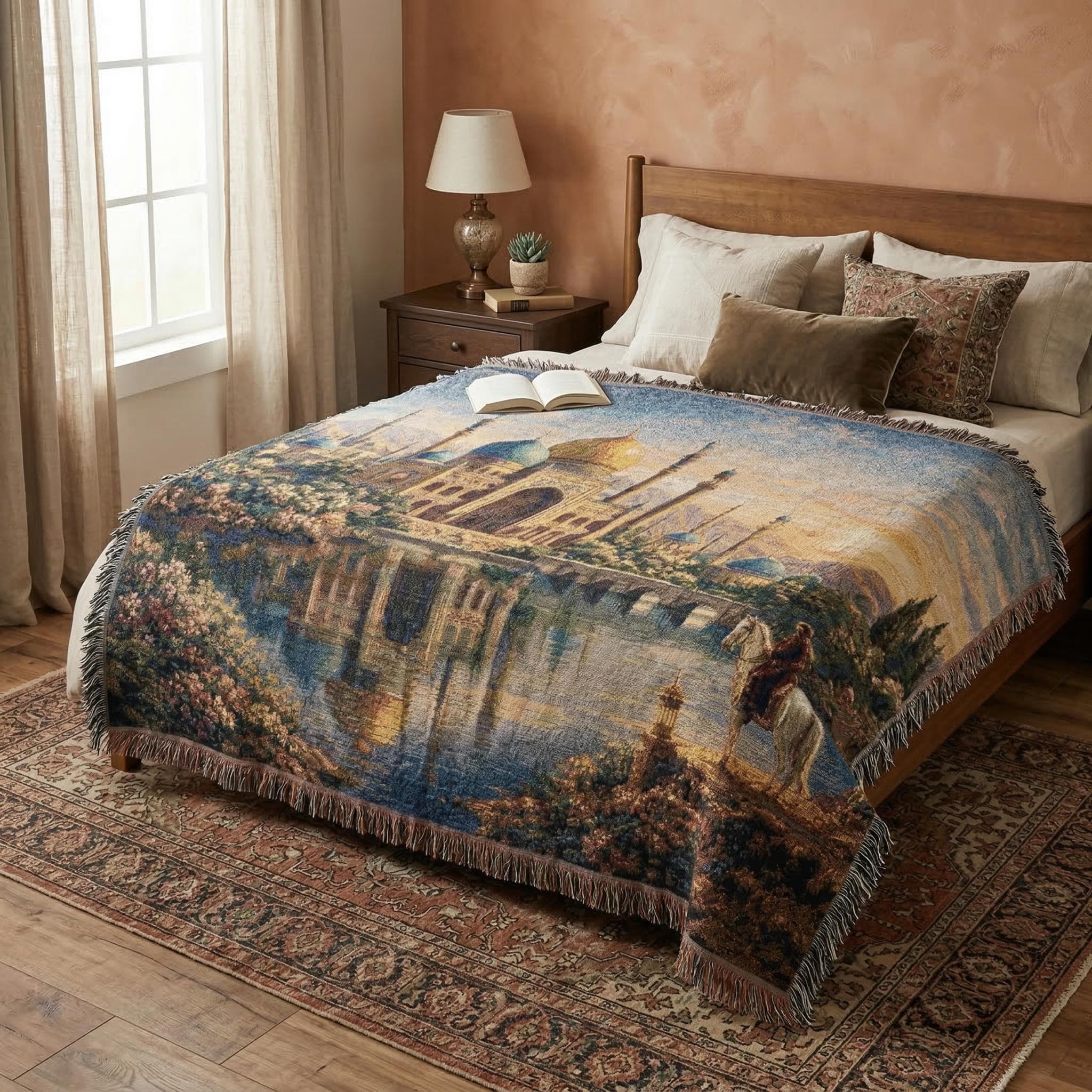 Woven tapestry wall hanging featuring a Persian inspired palace with golden dome, blue minarets, reflective lake, flower lined gardens, and a lone rider on horseback at sunset. Rich woven texture and fringe create an elegant old world look, perfect for Middle Eastern decor, Moorish wall art, maximalist bedroom decor, reading room styling, or as a woven throw blanket. Ideal for luxury vintage interiors, romantic landscape lovers, and ornate palace decor fans.