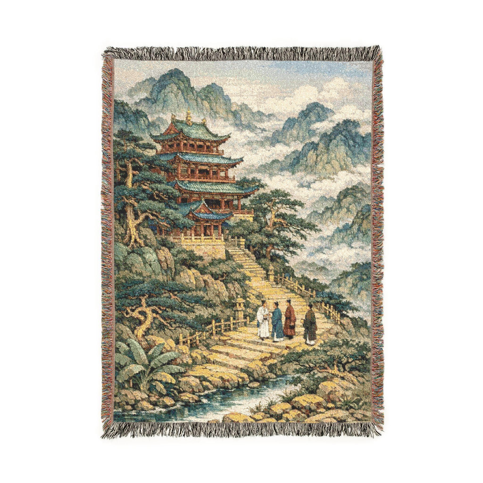 Woven tapestry wall hanging with fringe featuring a traditional Chinese pagoda temple perched on misty mountains above a winding river path, with travelers on stone steps, pine trees, and cloud-filled peaks. Vintage landscape look and rich woven texture make it perfect as wall decor or a cozy throw blanket. Beautiful for a zen room, tea nook, yoga studio, bedroom, dorm, or gallery wall. A thoughtful Asian inspired chinoiserie gift for tea lovers, meditation fans, and travel lovers.