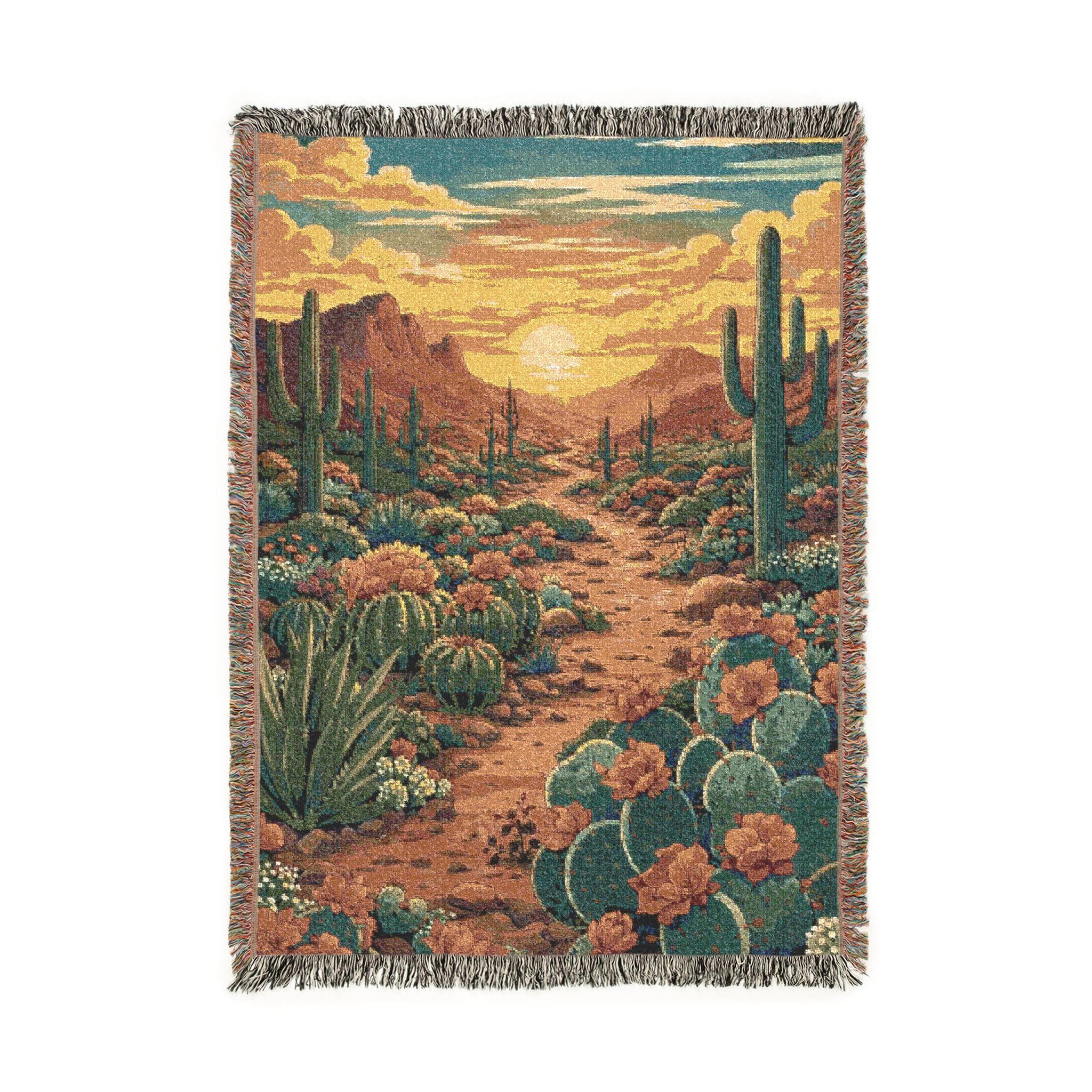 Woven tapestry wall hanging featuring a desert sunset landscape with saguaro cactus, prickly pear cactus, wildflowers, rocky trail, and warm golden sky over distant mountains. Southwestern wall decor in earthy terracotta, teal, sand sunset tones with woven texture and fringe edges. Perfect as boho desert wall hanging, western room decor, Arizona inspired home decor, cozy woven throw blanket for bedroom, living room, dorm, or reading nook. Great gift for desert lovers, hikers, and Southwest decor