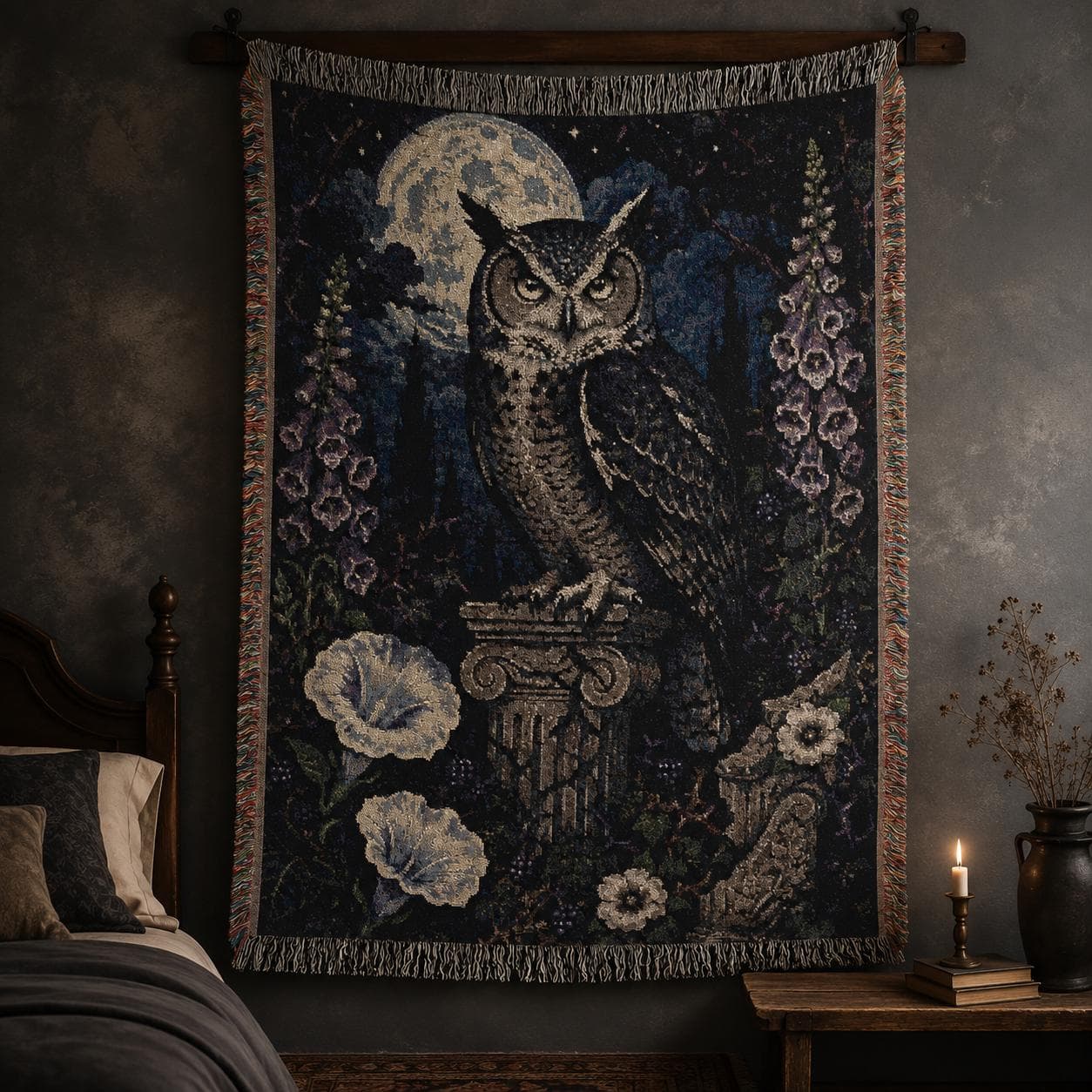 Vertical woven blanket wall hanging with a large owl on a stone column beneath a full moon, surrounded by purple foxglove-like flowers, white moonflowers, dark foliage, starry night sky, and fringed textile edges.