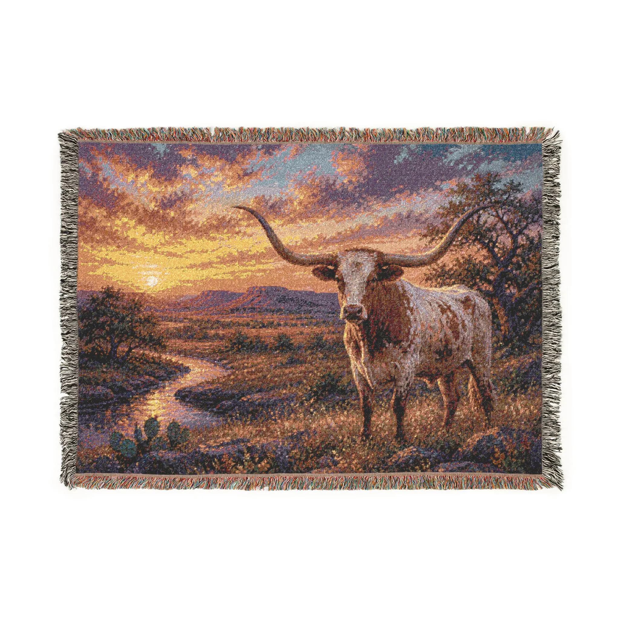 Woven tapestry wall hanging featuring a Texas longhorn standing in a western desert landscape at sunset, with sweeping horns, glowing sky, winding creek, cactus, and rustic open range scenery. Southwestern wall art with ranch decor charm, country texture, and warm golden light, ideal as a large wall tapestry, woven throw blanket, western home decor accent, rustic living room art, entryway decor, bedroom wall decor, and gift for longhorn lovers, ranch style collectors, and cowboy decor fans.