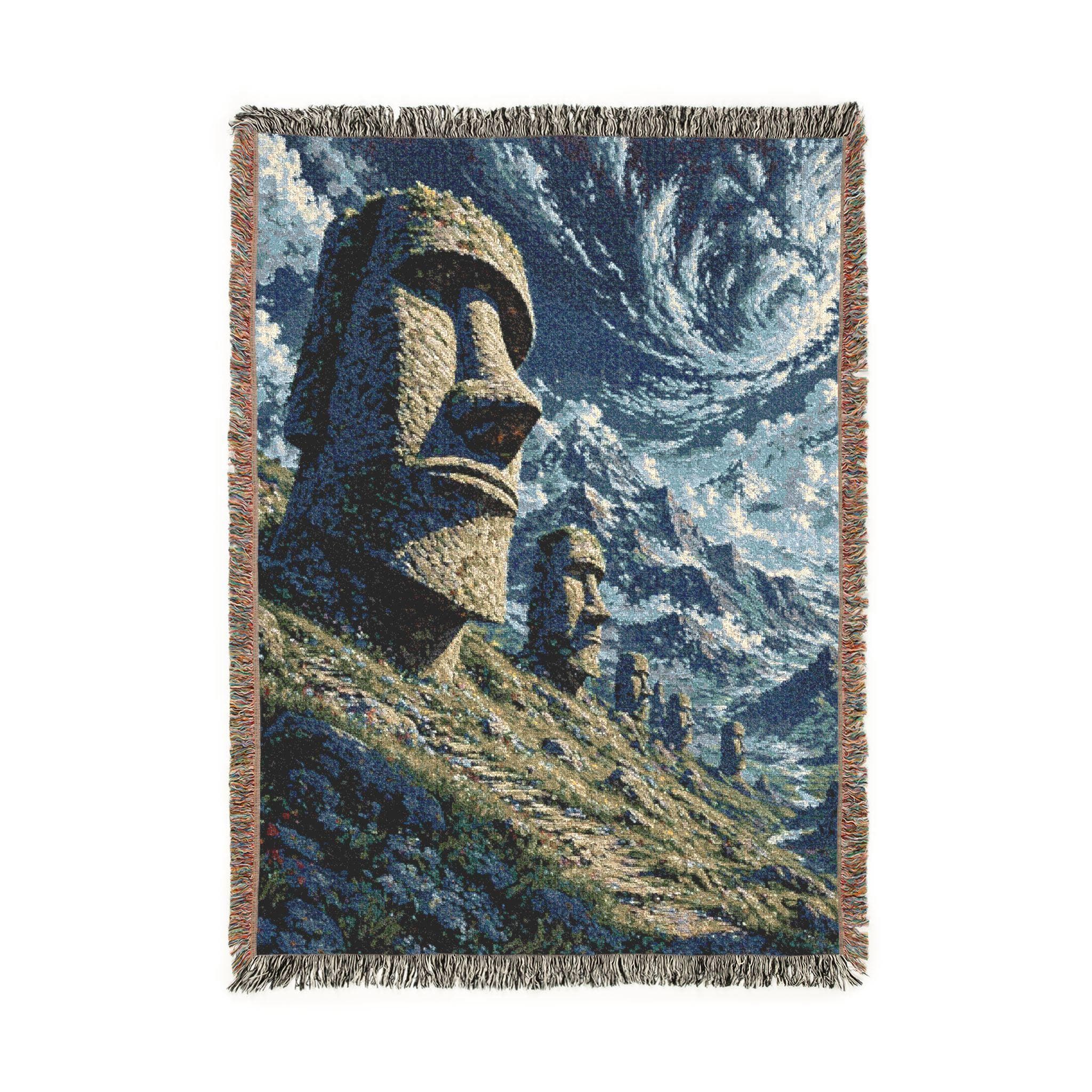 Woven tapestry wall hanging featuring towering Easter Island moai statues set along a rugged mountainside beneath a dramatic swirling sky with textured blue clouds and distant rocky peaks. Ancient monument wall art with bold stone head imagery, mystical landscape atmosphere, and old world travel charm, ideal as a large wall tapestry, woven throw blanket, statement room accent, history inspired home decor, and gift for travelers, archaeology lovers, and collectors of striking cultural scenery.
