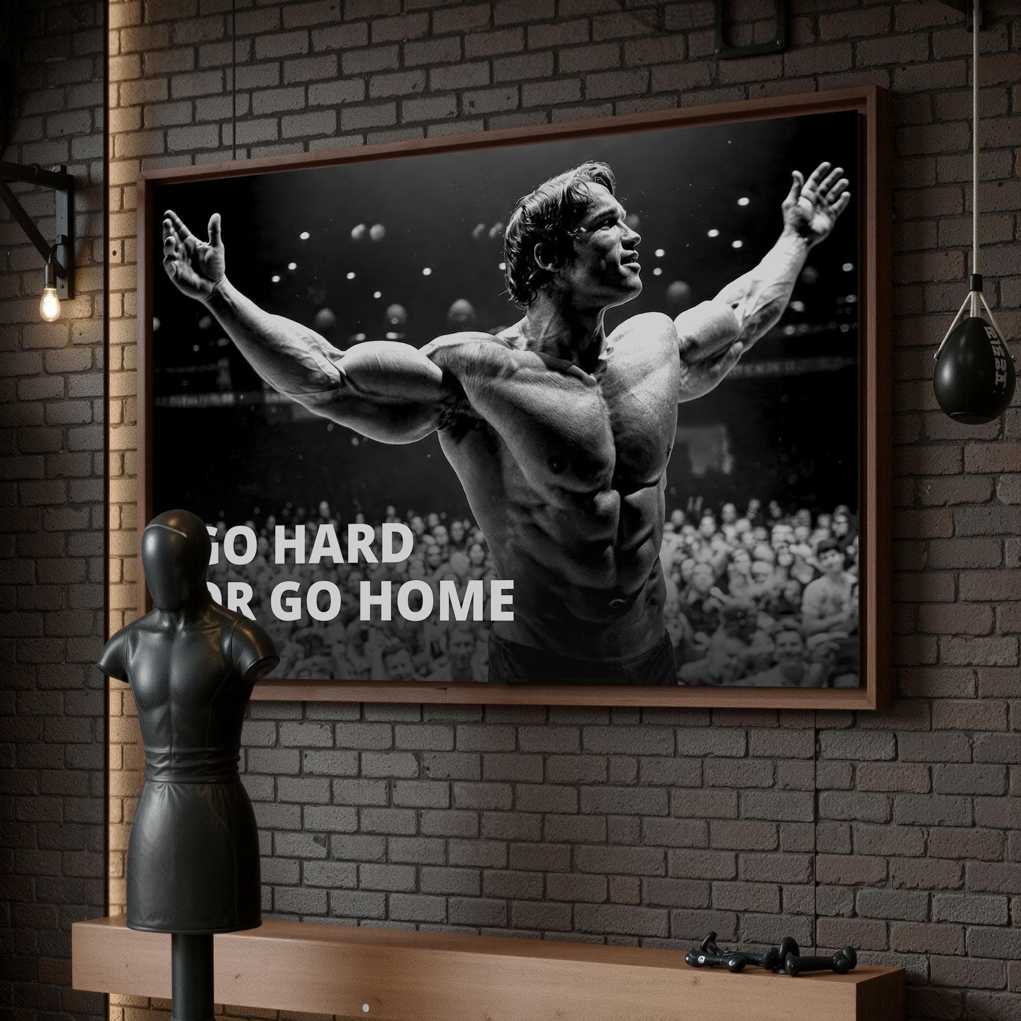 Iconic black and white bodybuilding canvas featuring Arnold Schwarzenegger with motivational text Go Hard Or Go Home in a home gym setting.