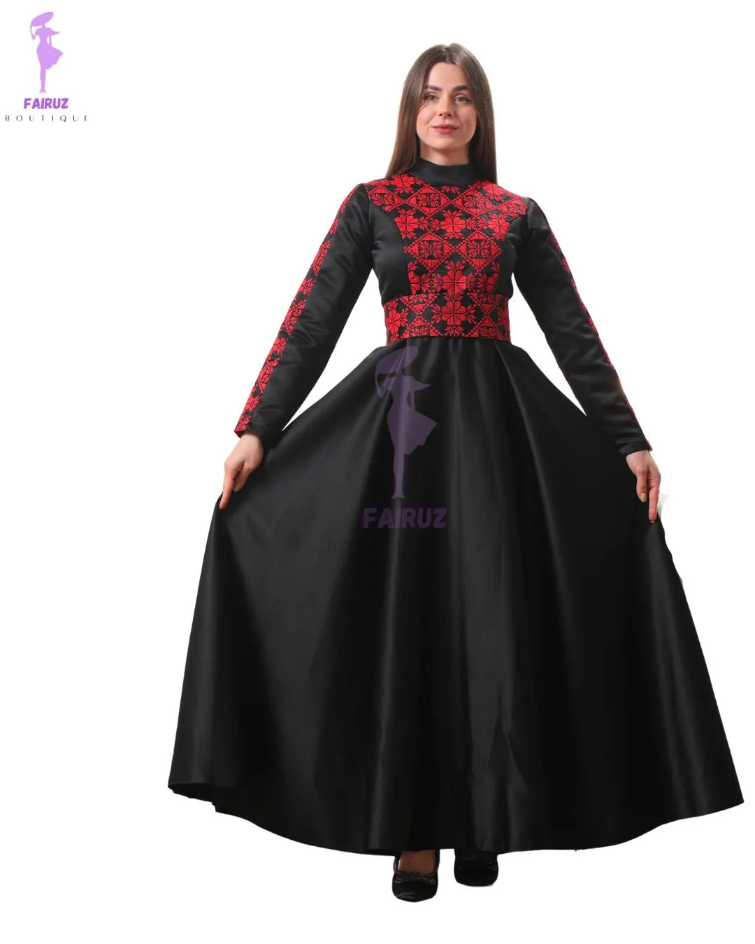 May include: A long black dress with a high neckline and long sleeves. The bodice and sleeves feature intricate red embroidery. The dress is from Fairuz Boutique, as indicated by the logo in the upper left corner.
