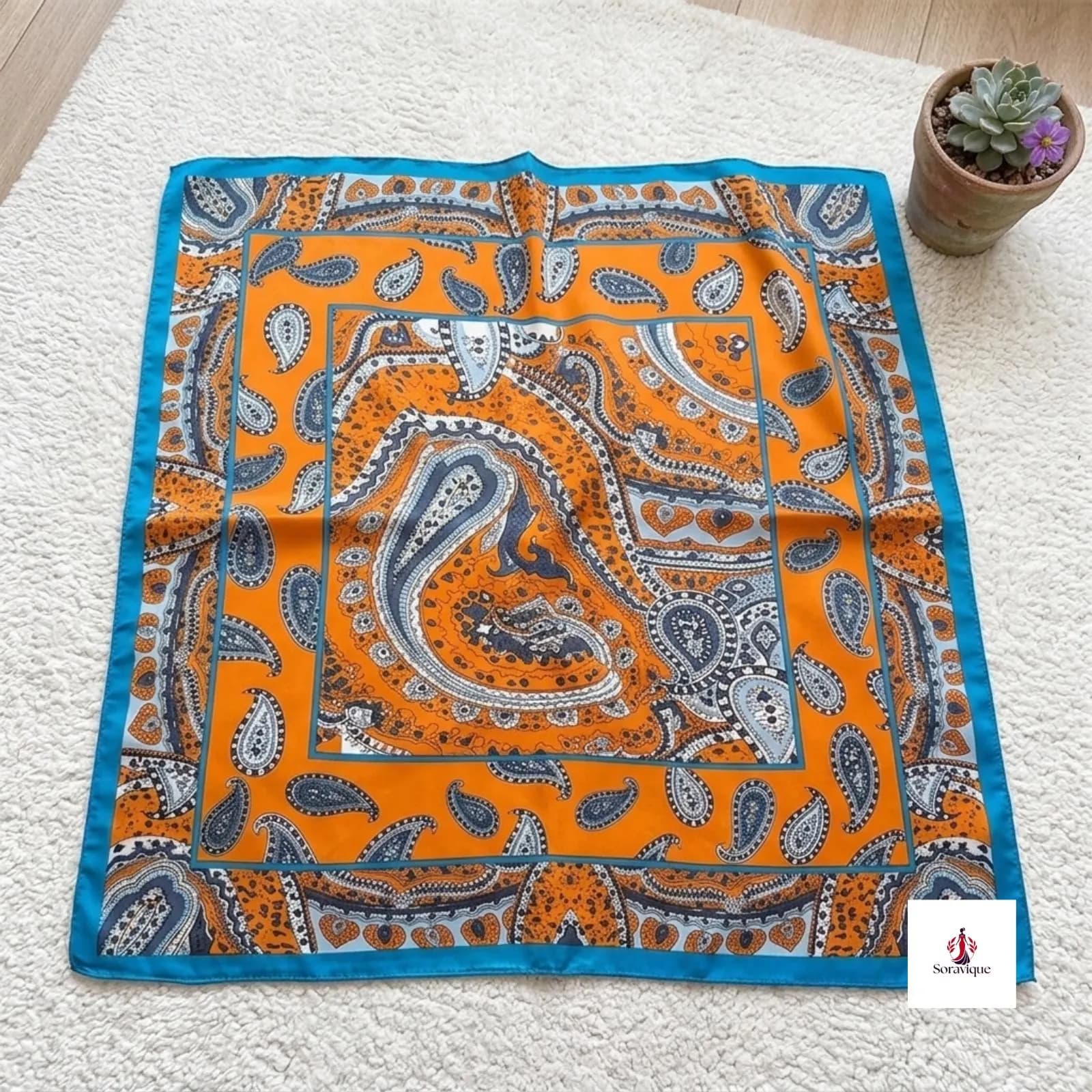 Folded polyester scarf displayed neatly.