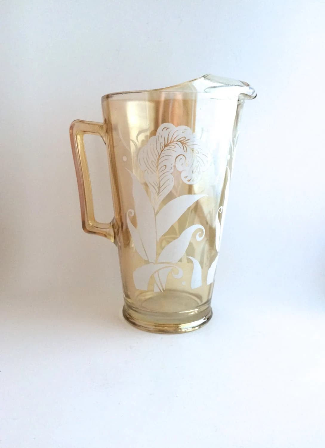 Vintage Deco Pitcher in Jeannette Glass. Lemonade, Beverage Container.  MCM  Bar Cart. Iridescent Peach Iris and Feather Design.