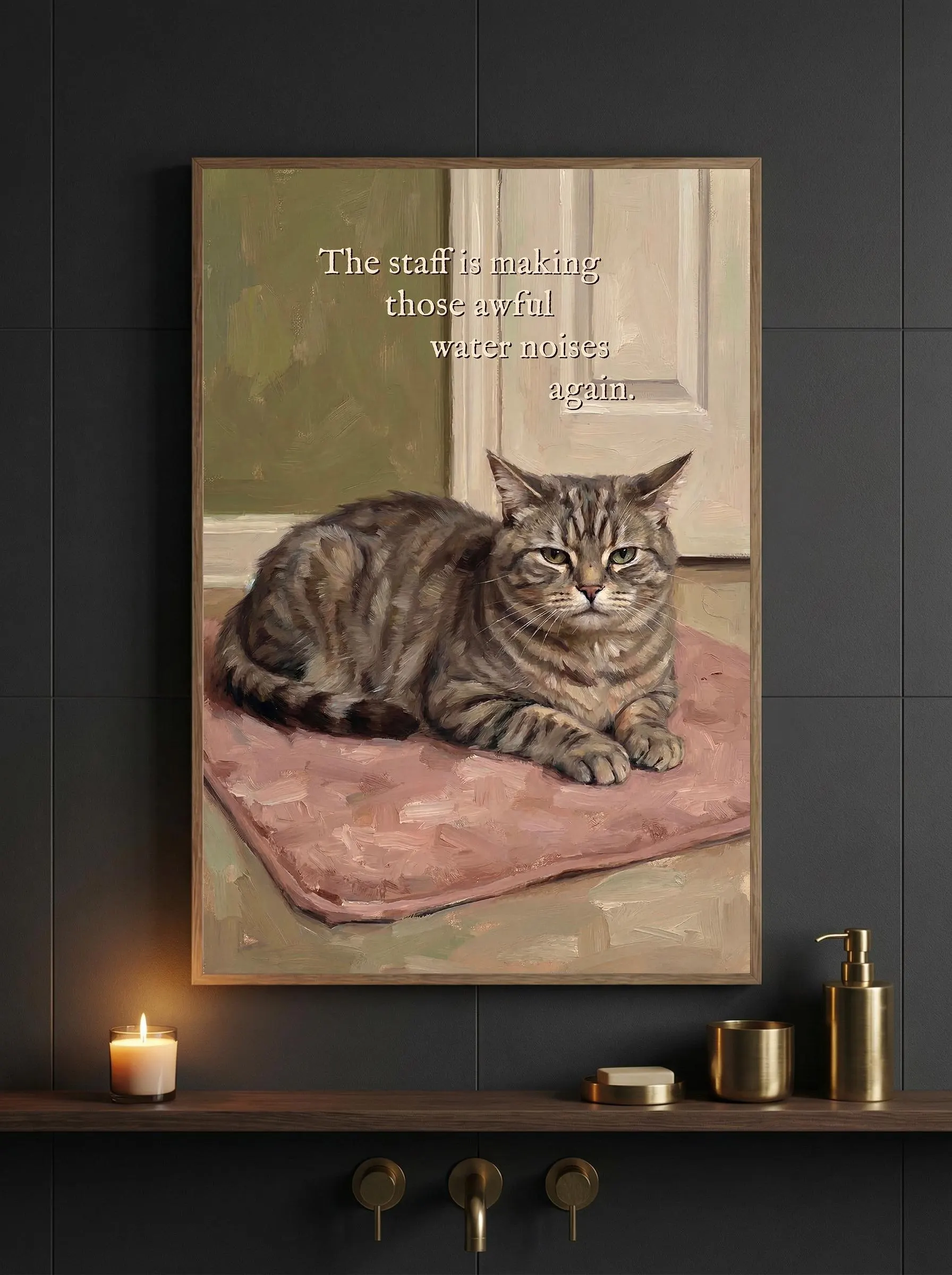 Oil painting style poster. Grumpy brown tabby cat with green-yellow eyes lies on a pink bath mat in front of a closed white door, olive green wall behind, impressionist brushwork. Quote: "The staff is making those awful water noises again." Funny tabby cat bathroom art print.