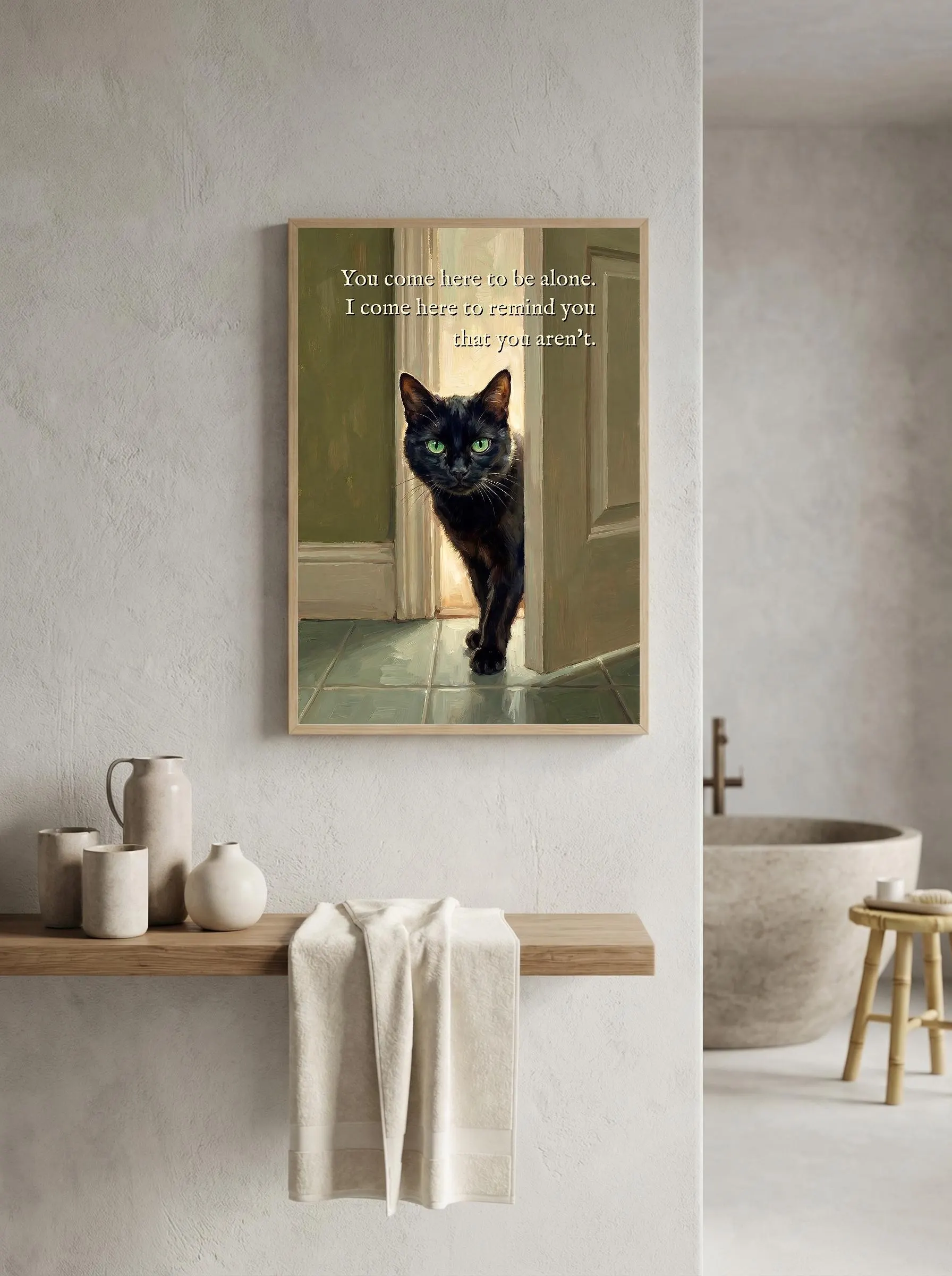 Funny black cat bathroom art. Black short-haired cat with intense green eyes entering through a doorway, golden warm light behind, sage tile floor, oil painting aesthetic. Text: "You come here to be alone. I come here to remind you that you aren't." Sarcastic dopamine decor wall print.