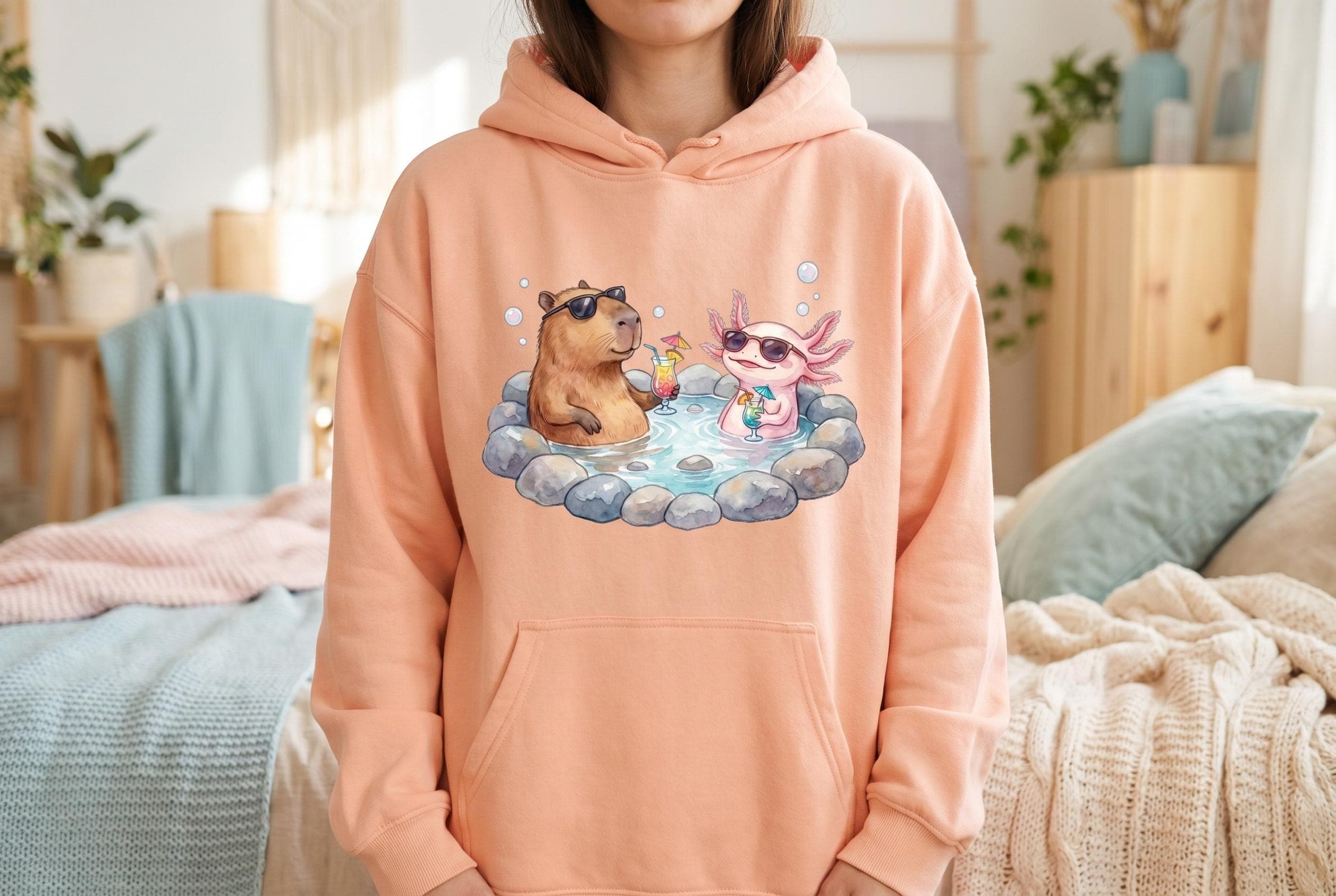 Hoodie with Capybara Axolotl PNG — watercolor capybara and pink axolotl in sunglasses in a stone hot spring with cocktails, "This Is Productive Actually" retro script above. Funny meme shirt capybara designs placement example.