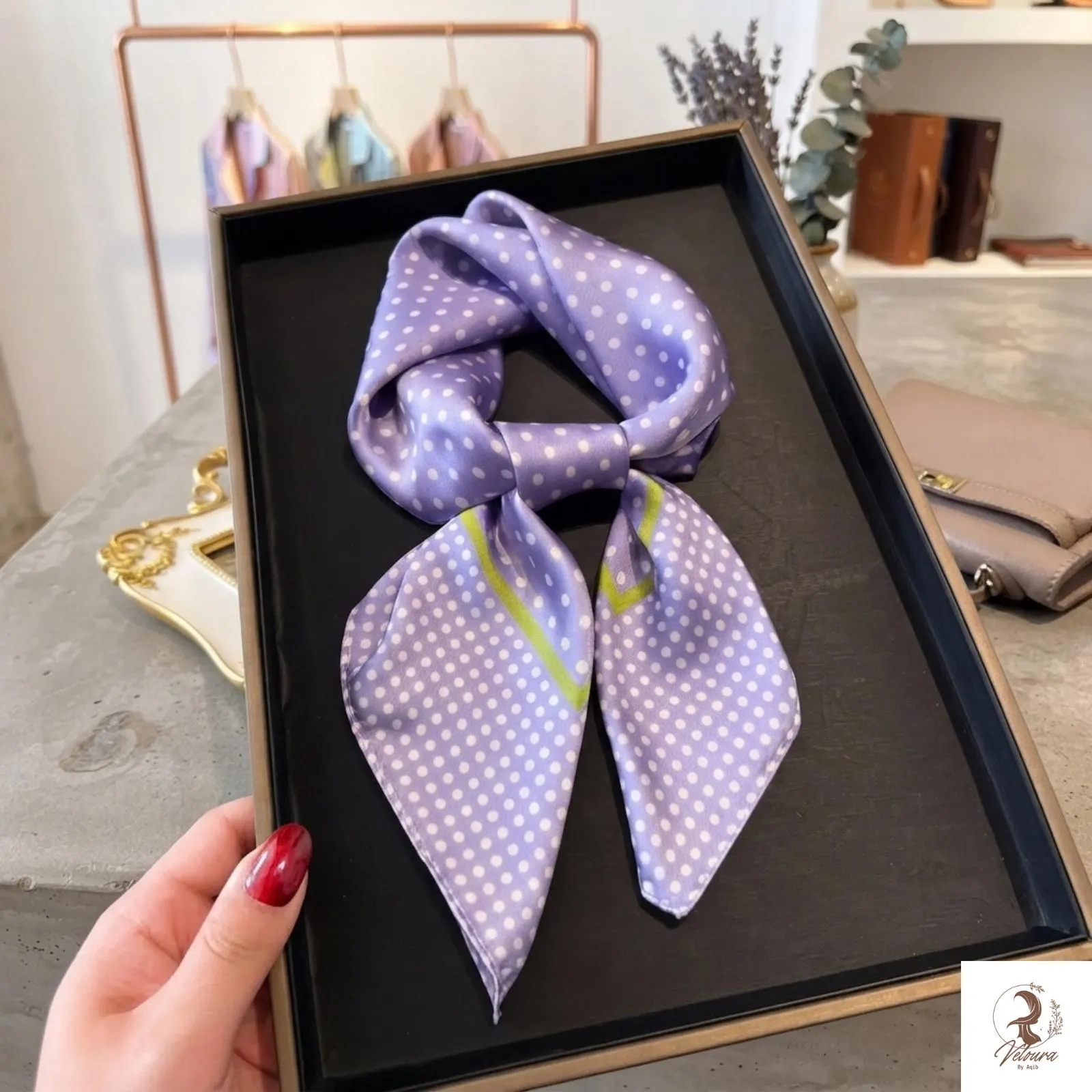 Small square scarf styled as a hair accessory