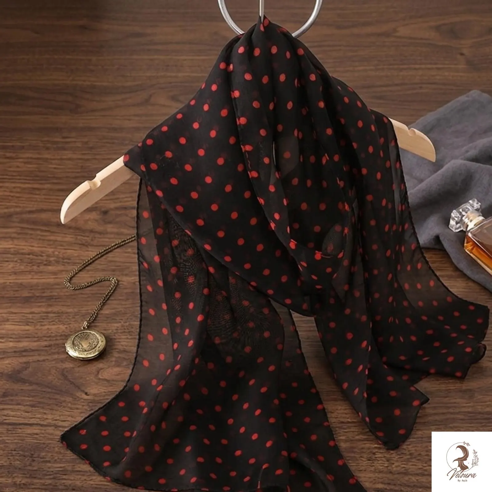 Floral print chiffon scarf styled as a lightweight neck wrap.