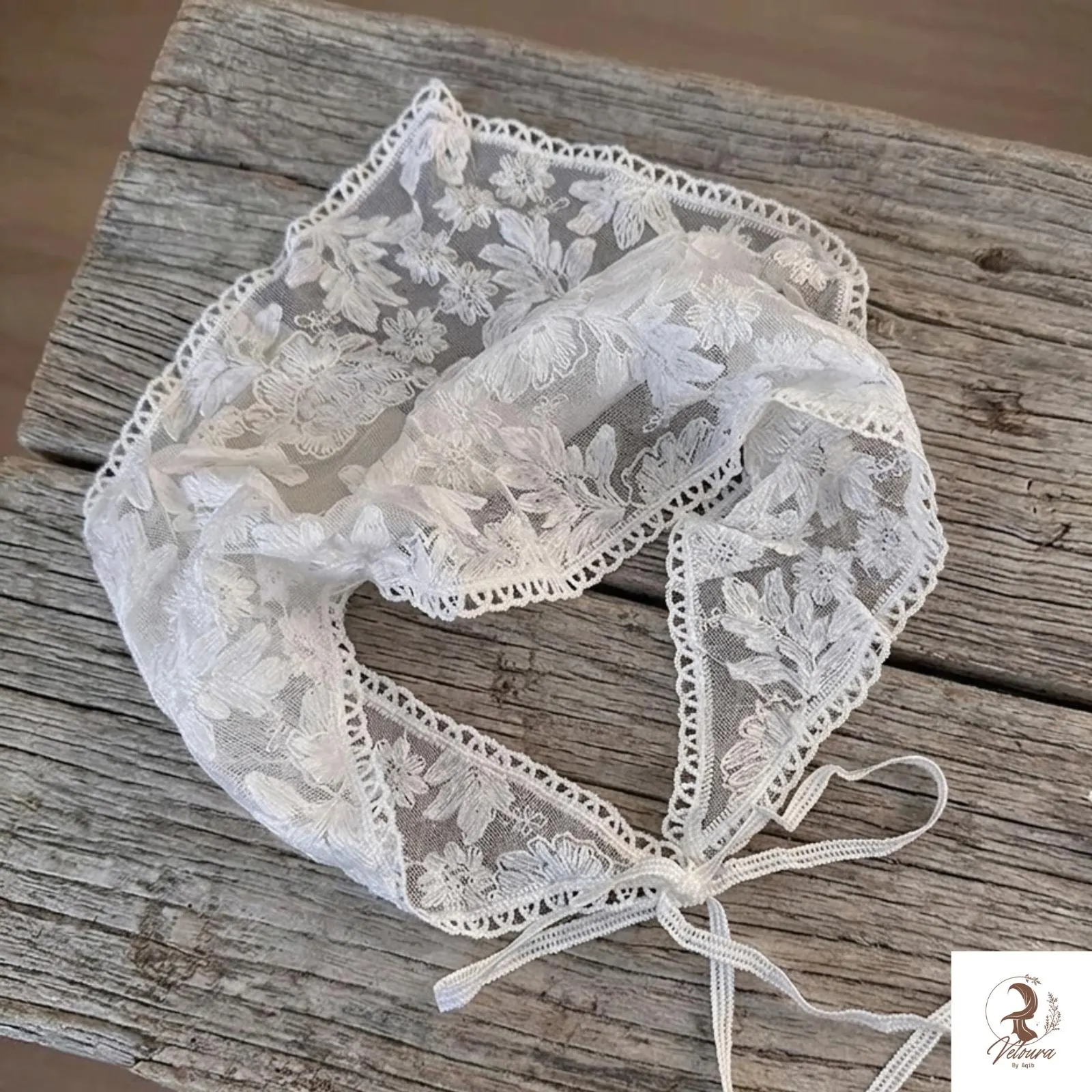 Close-up view of lace trim and printed bandana pattern
