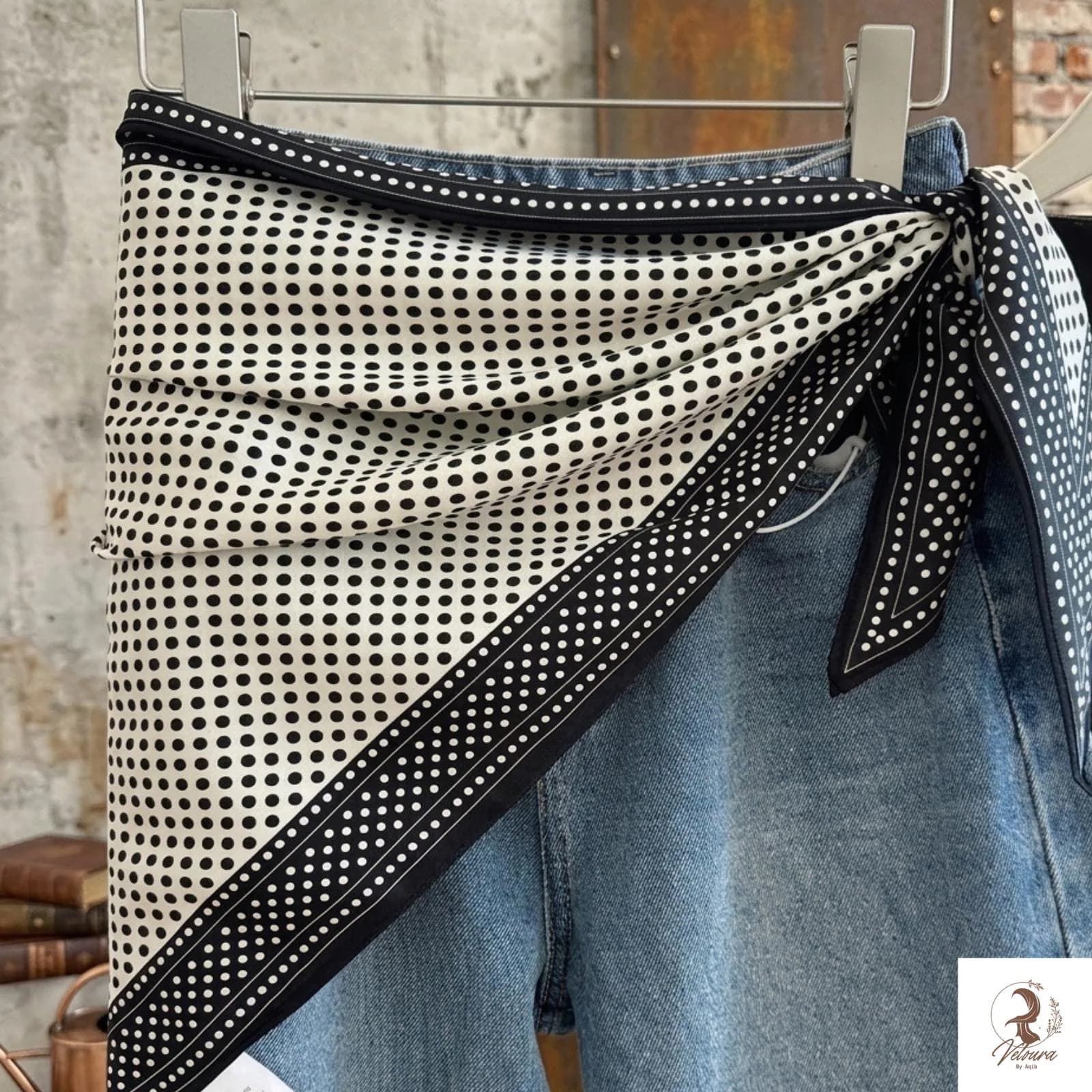Close-up view of the floral pattern and smooth scarf finish