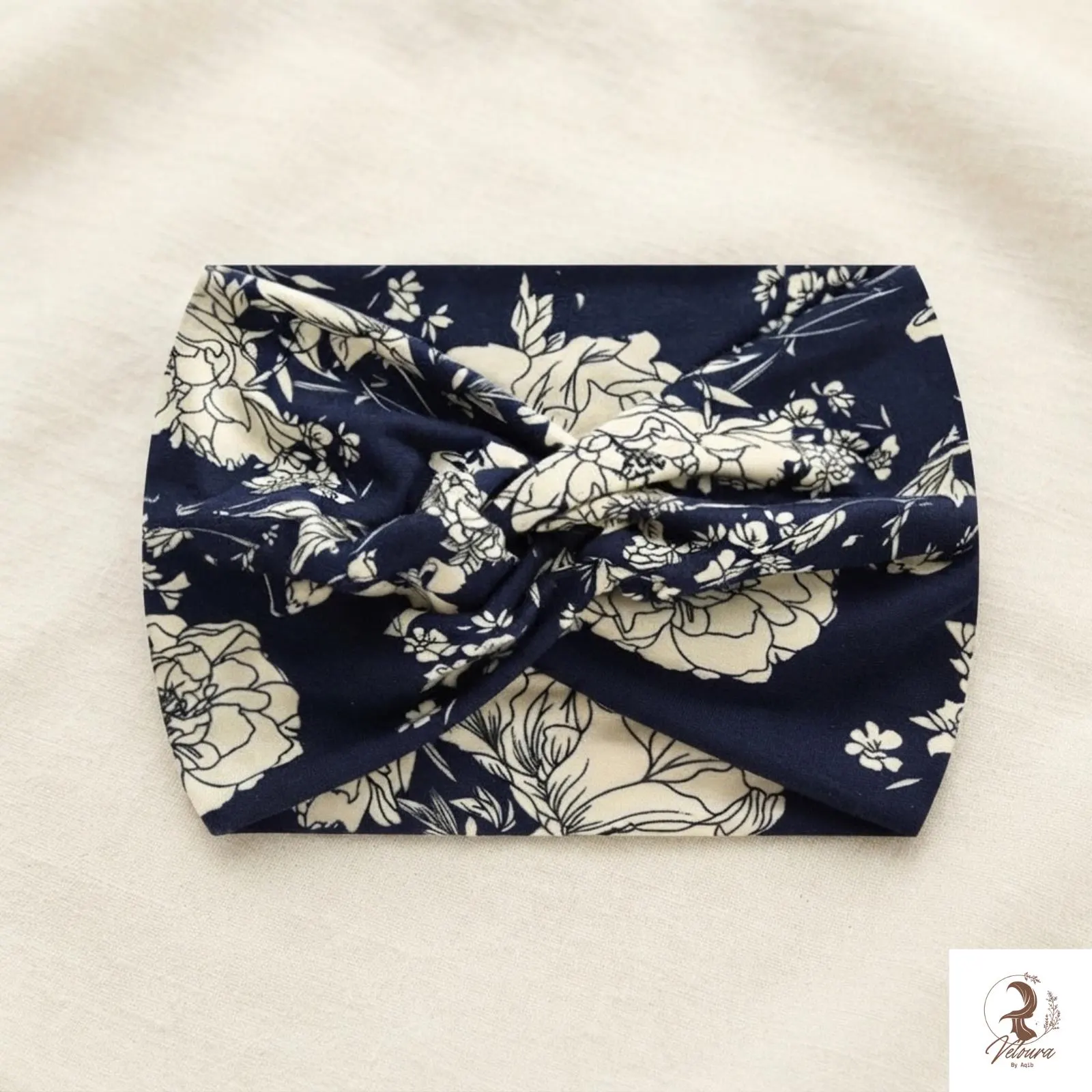 Wide printed stretch sweatband styled as a casual hair accessory