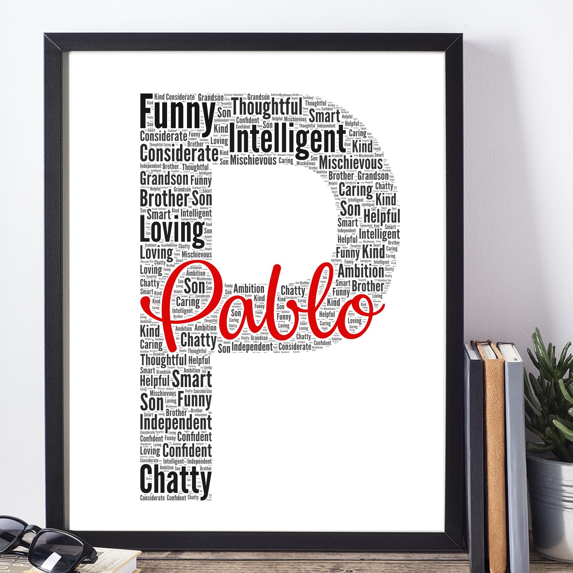 Personalised initial silhouette wall art created from custom words and names, displayed in a modern white wooden frame on a colourful nursery wall