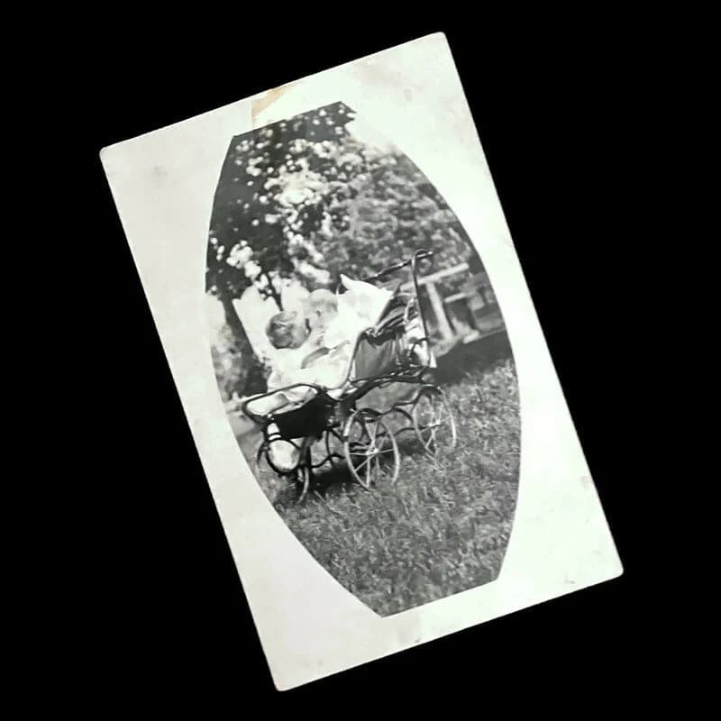 1910s Edwardian Baby Photo Postcard: Children Kissing in Stroller