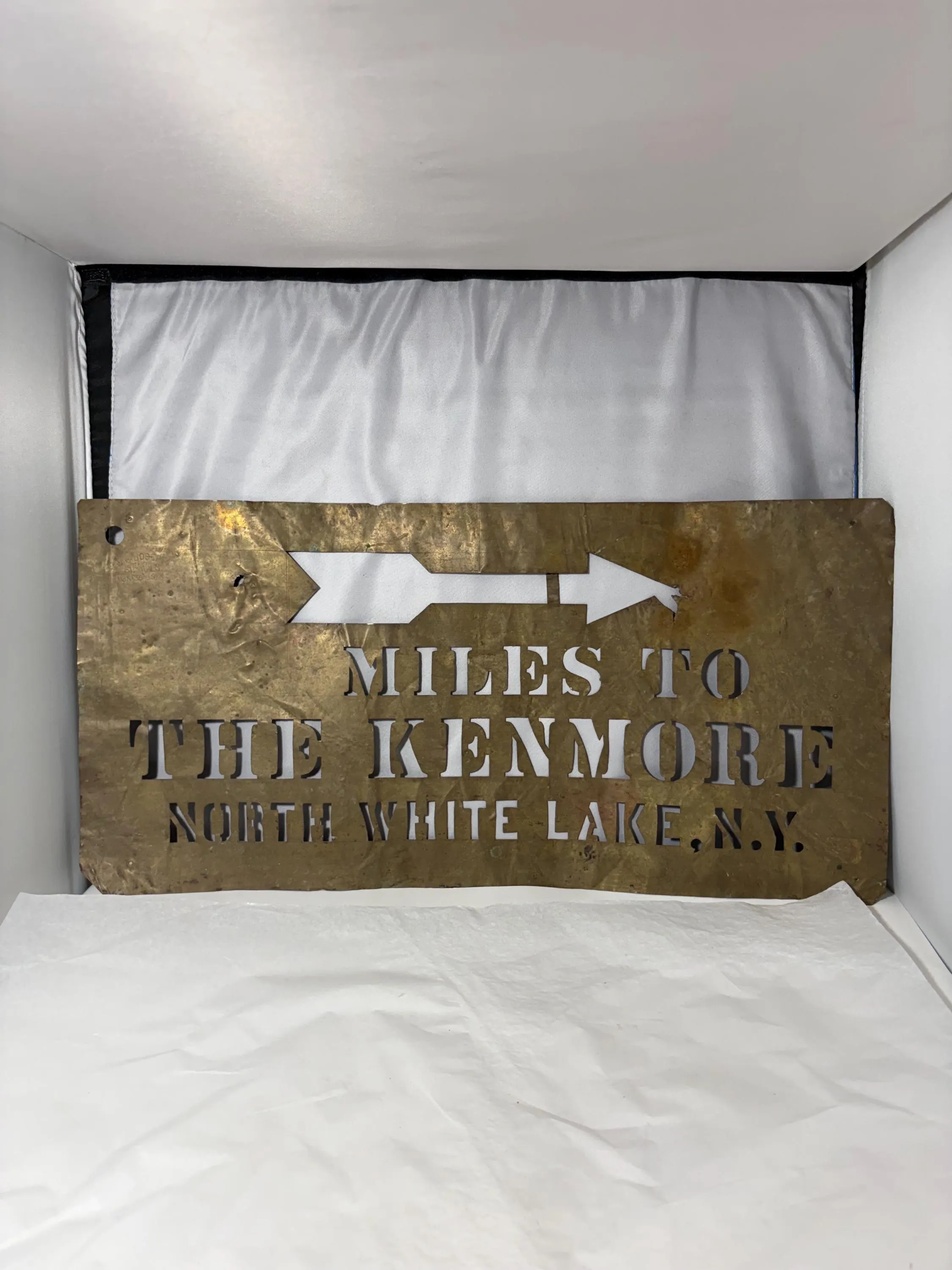 an original antique brass roadside sign for The Kenmore Resort in North White Lake, NY