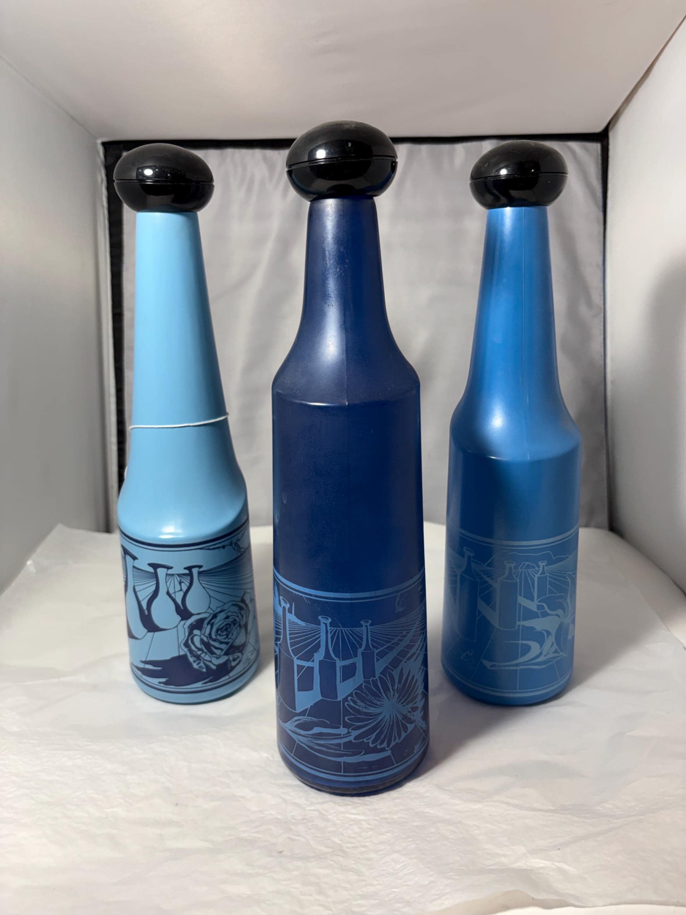 Mid-Century Rosso Antico Art Glass Bottles, Salvador Dalí design, circa 1970, frosted blue, collectible set