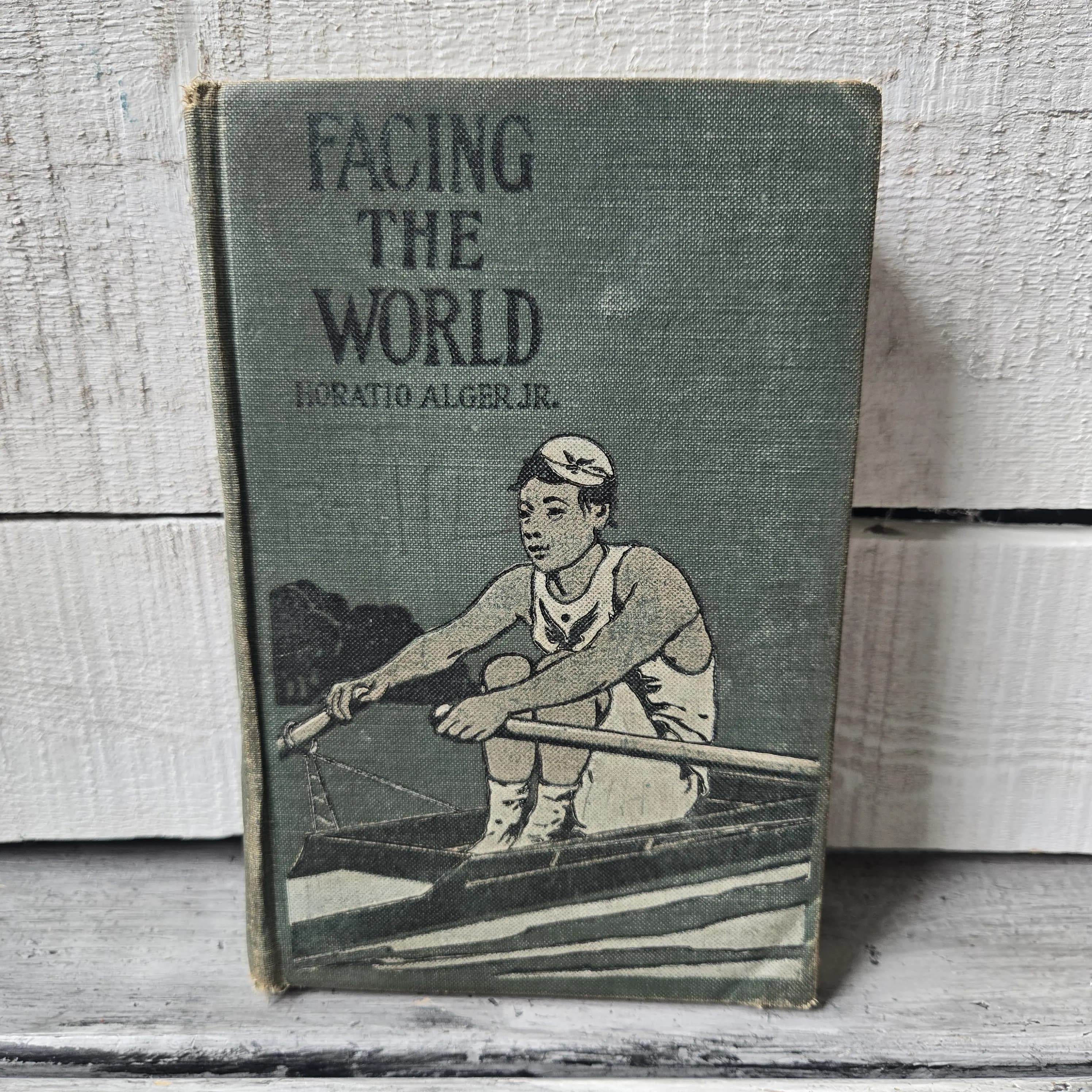Antique Facing the World book by Horatio Alger Jr. early 1900's, antique green book, antique Horatio Alger Jr. book, tattered green book