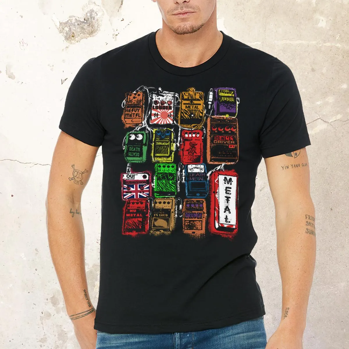 Male model wearing the shirt in urban setting, edgy heavy metal style with guitar case