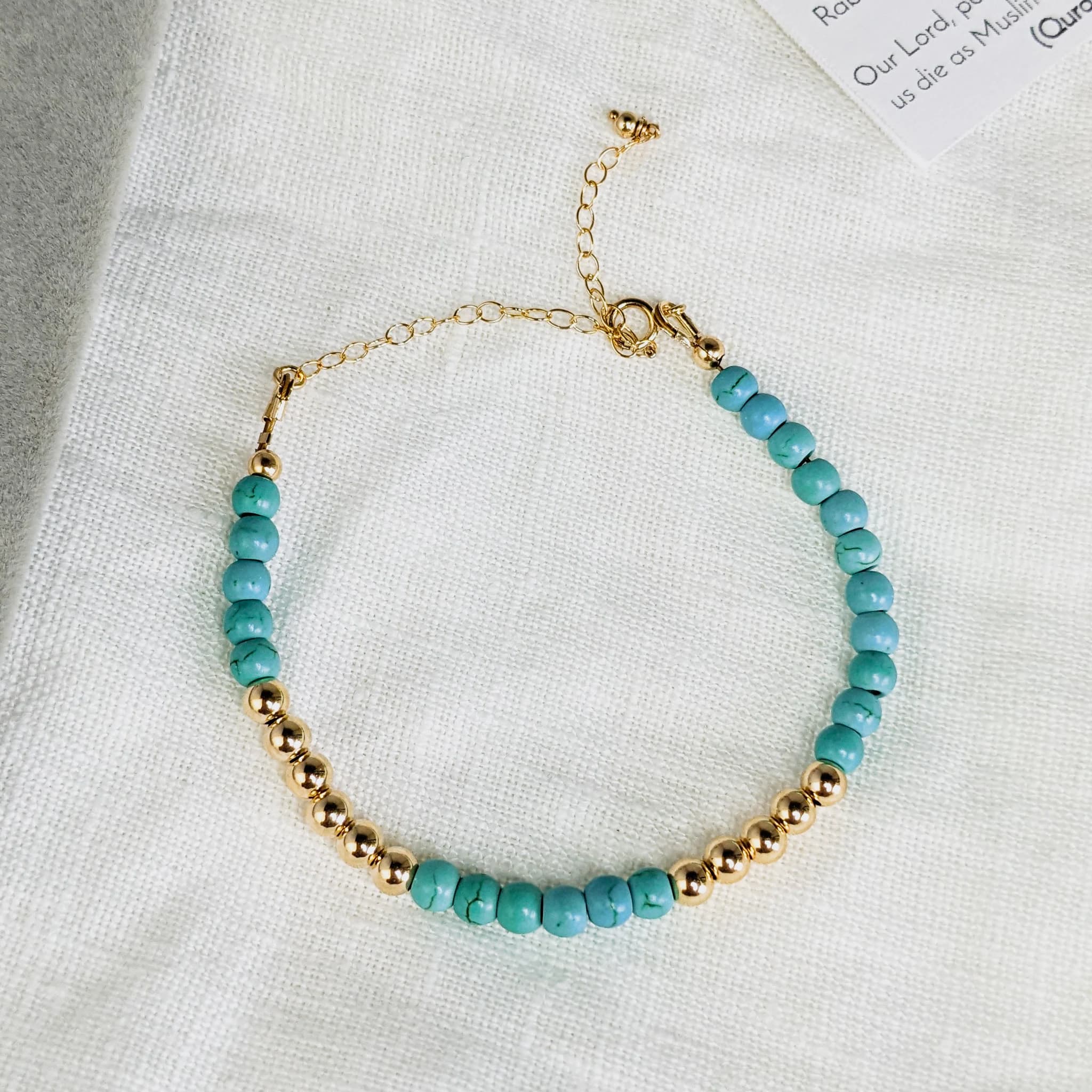 Tasbih Bracelet made with 33 turquoise and 14k gold filled tasbeeh beads. Bracelet is made with gold filled finishings and durable jewelry wire. Tasbih Bracelets are made with 1 to 2 extra bead spaces to support islamic prayer.