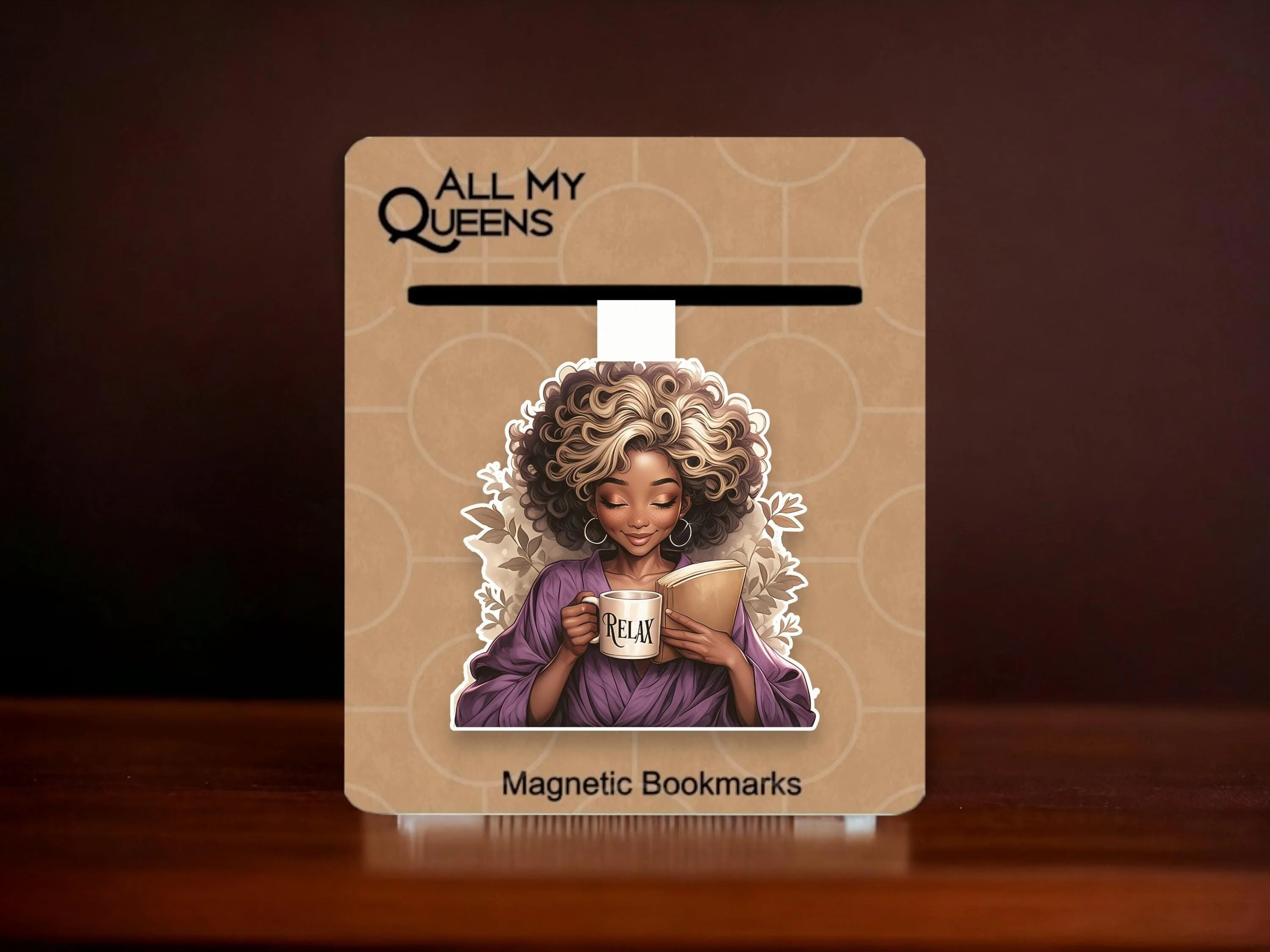 May include: A purple magnetic bookmark featuring a woman with curly blonde hair holding a mug that says "Relax" and a book. The bookmark is on a brown background with the text "All My Queens" and "Magnetic Bookmarks".