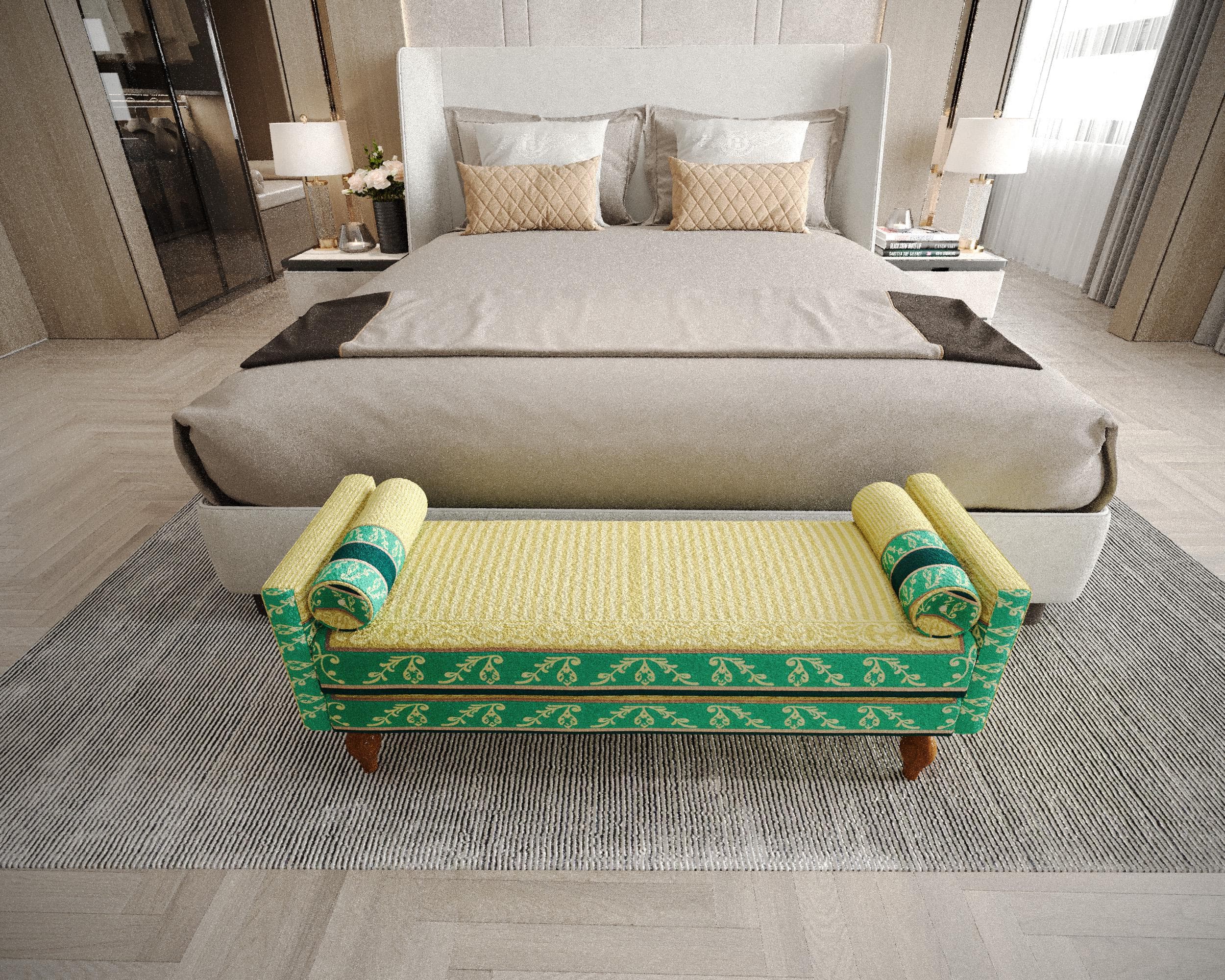 a luxurious bedroom with a large bed, a green and yellow bench, and a gray rug.